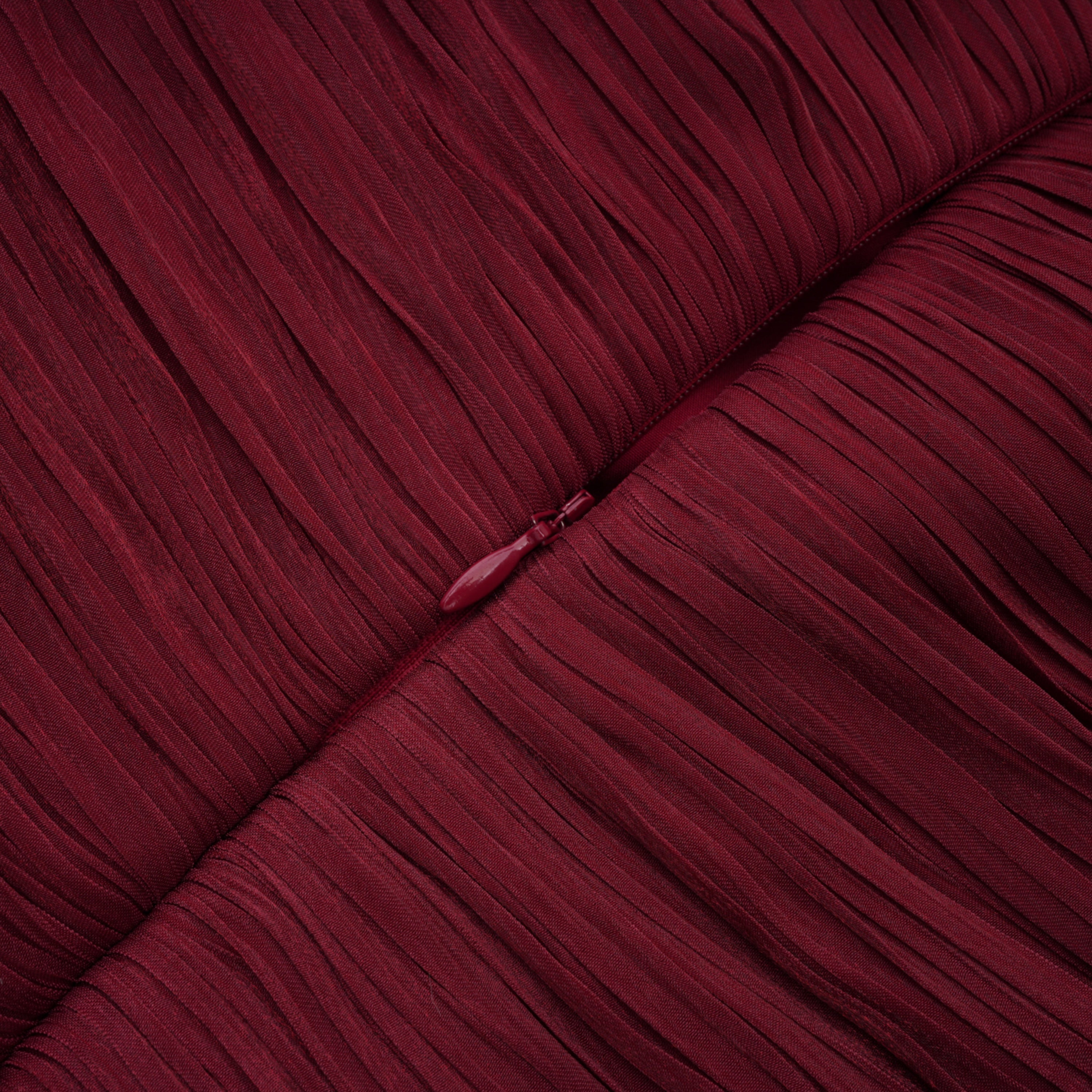 Burgundy pleated strapless gown with matching cape and high slit