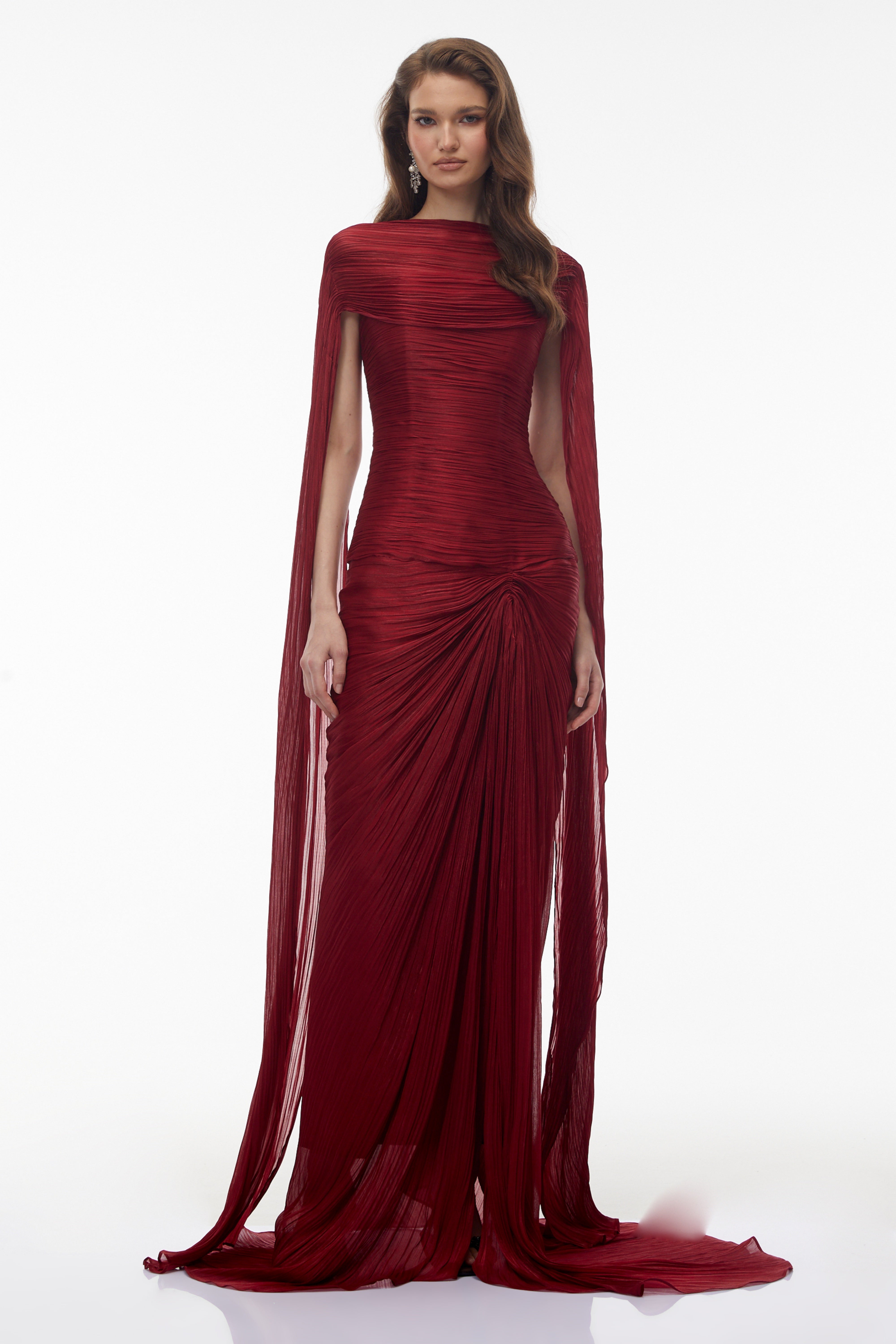 Burgundy pleated strapless gown with matching cape and high slit