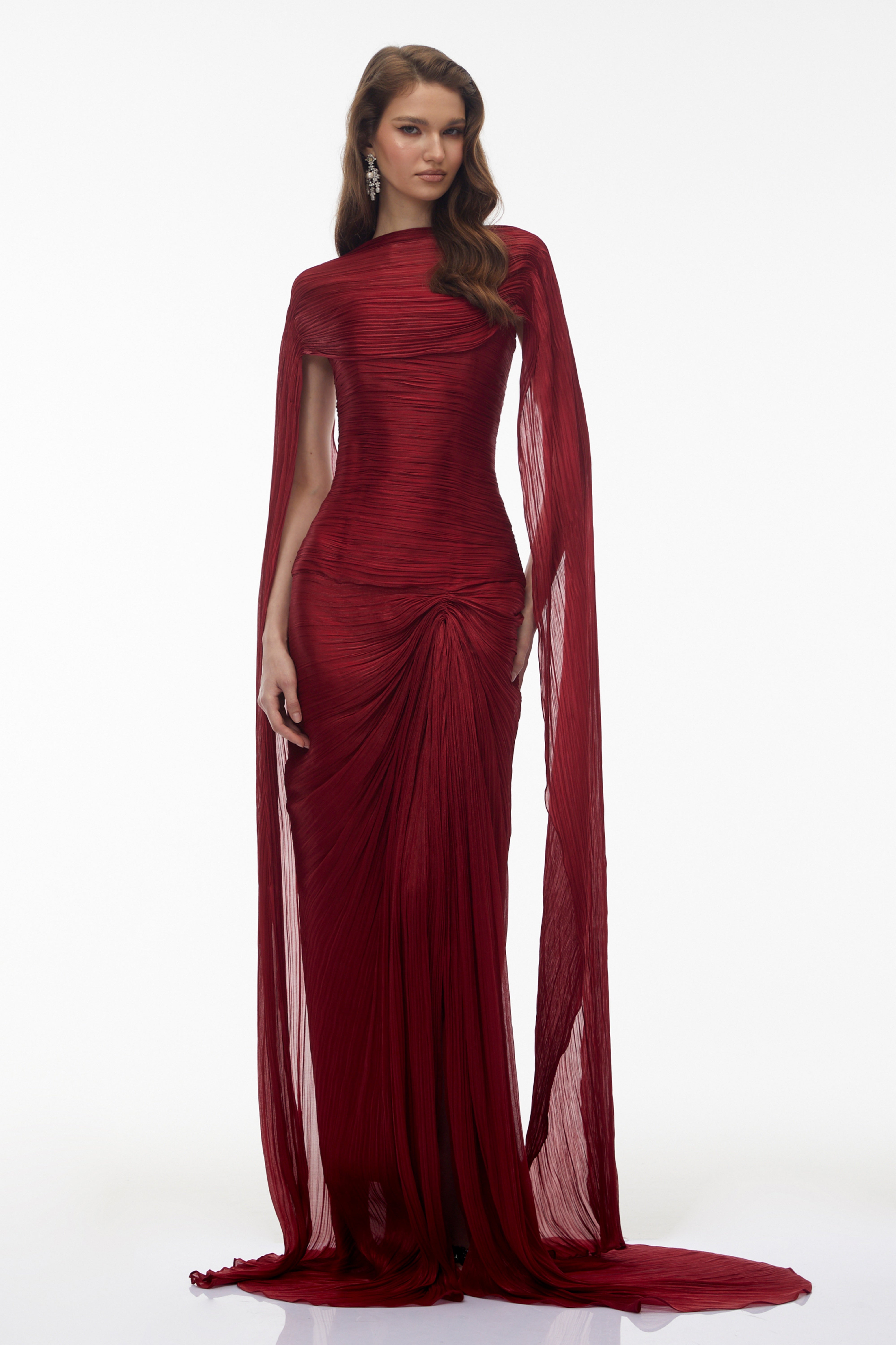 Burgundy pleated strapless gown with matching cape and high slit