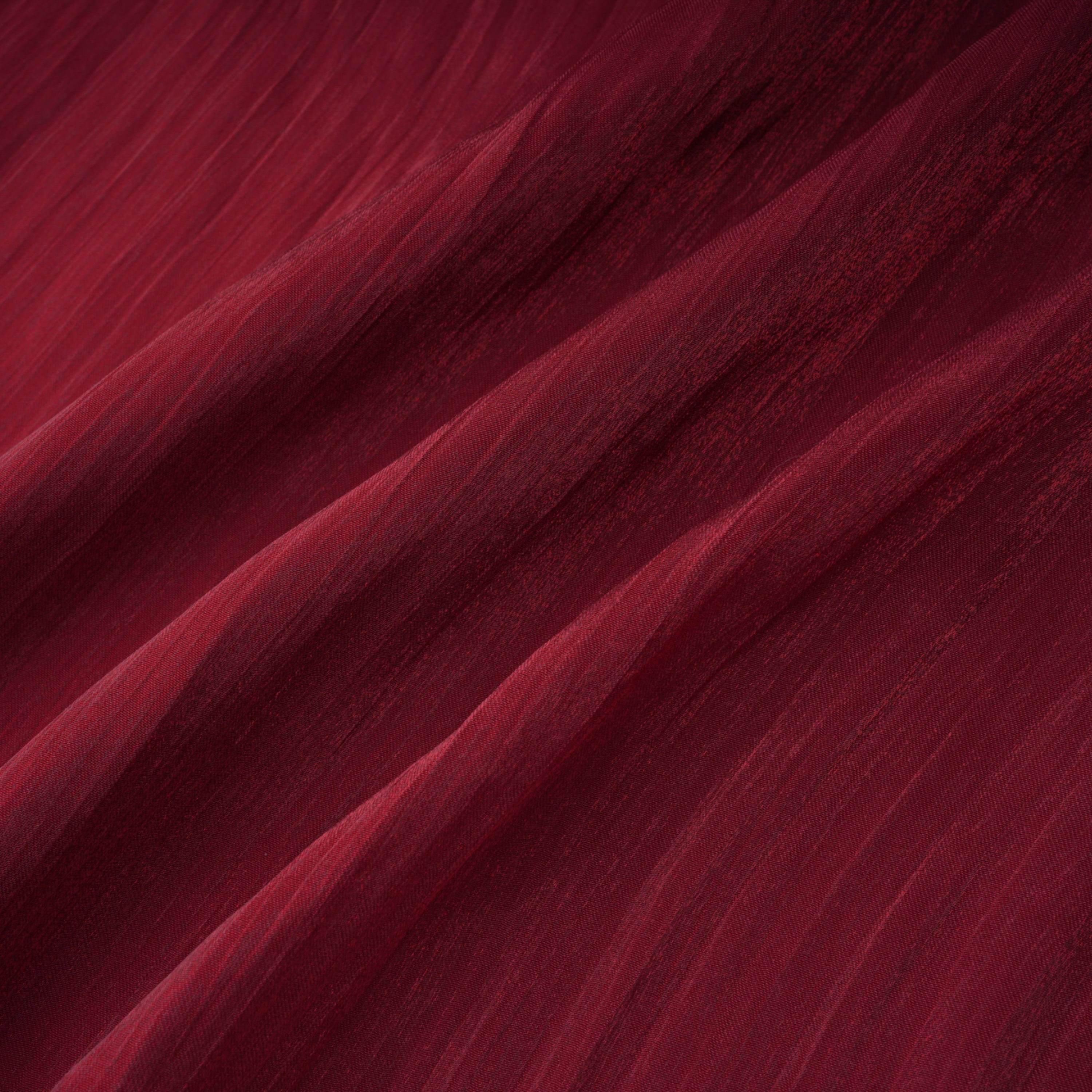 Burgundy pleated strapless gown with matching cape and high slit