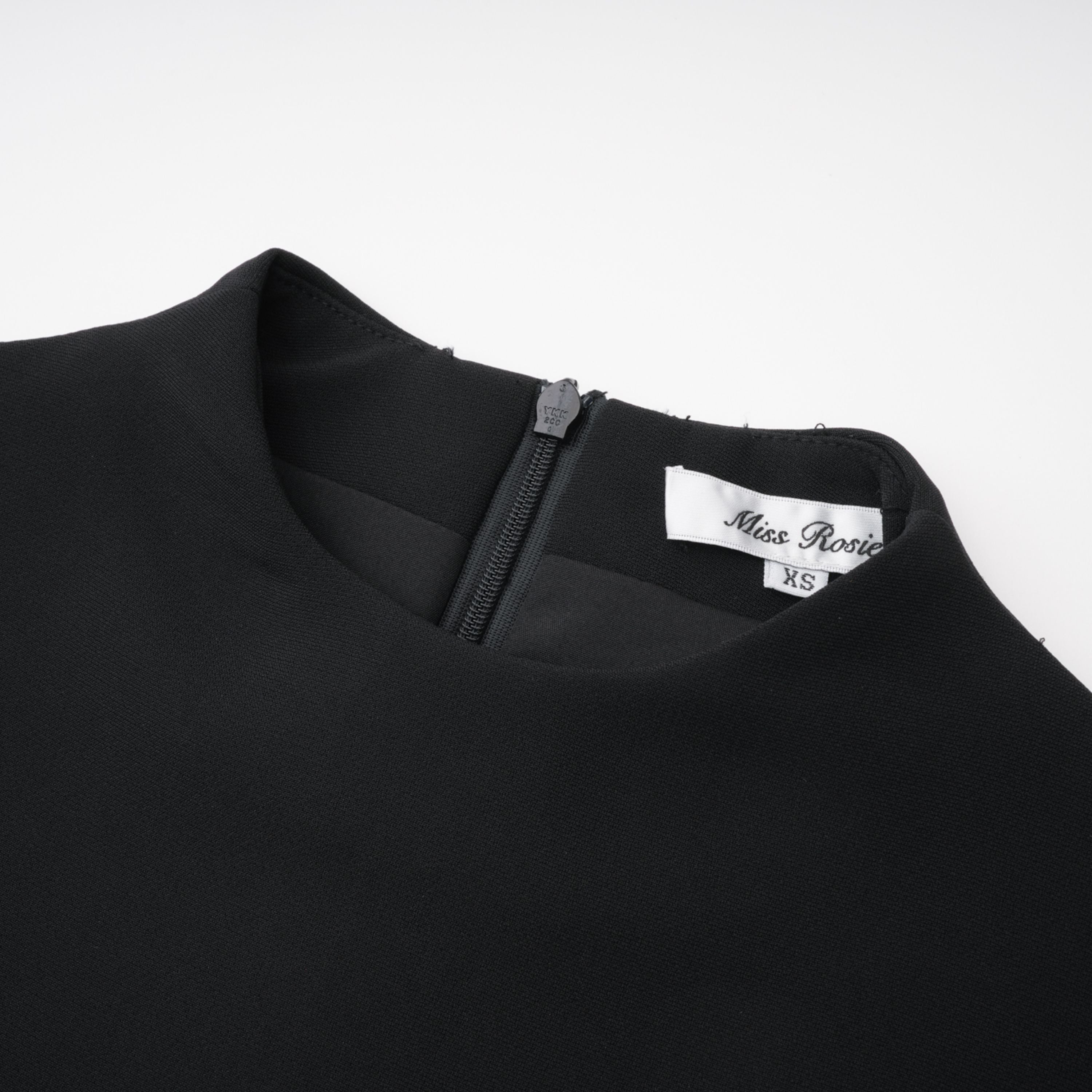 Black structured two-piece midi set with a boxy crop top and an exaggerated hip midi skirt