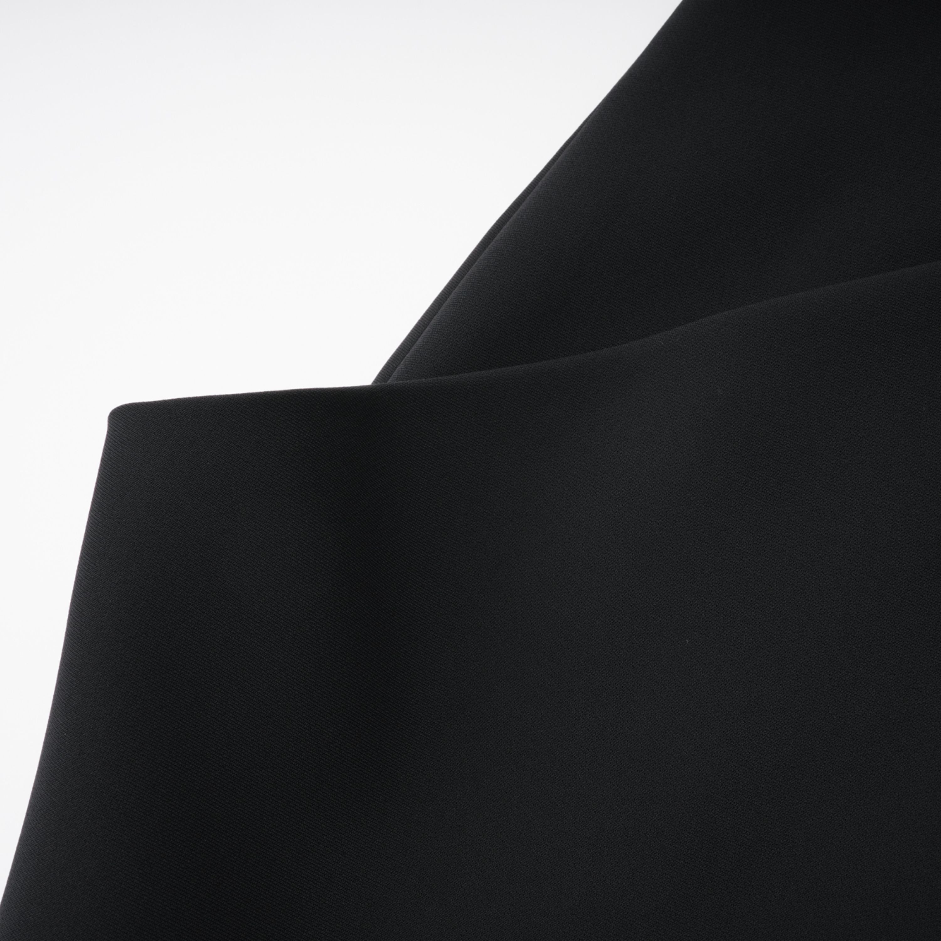 Black structured two-piece midi set with a boxy crop top and an exaggerated hip midi skirt