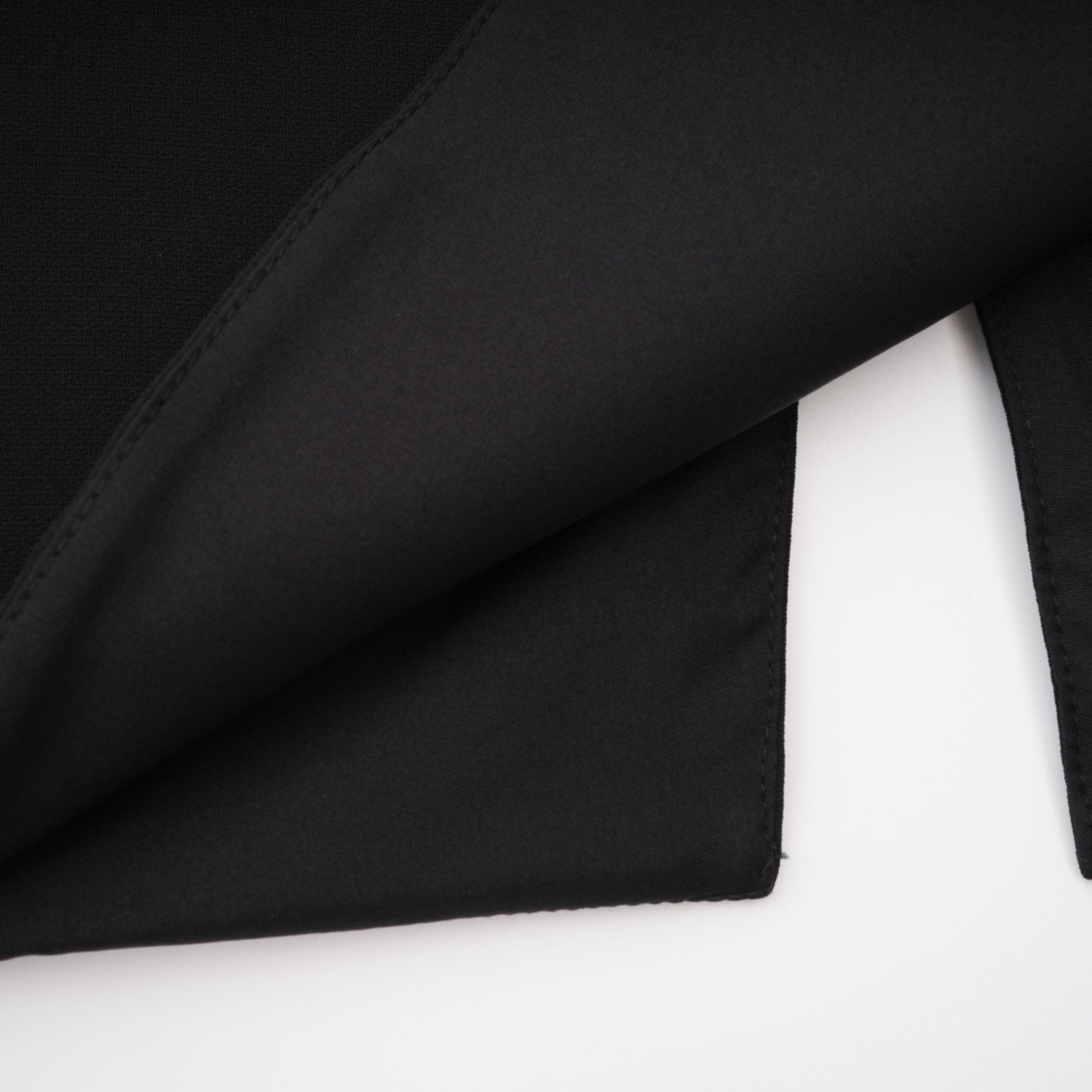 Black structured two-piece midi set with a boxy crop top and an exaggerated hip midi skirt
