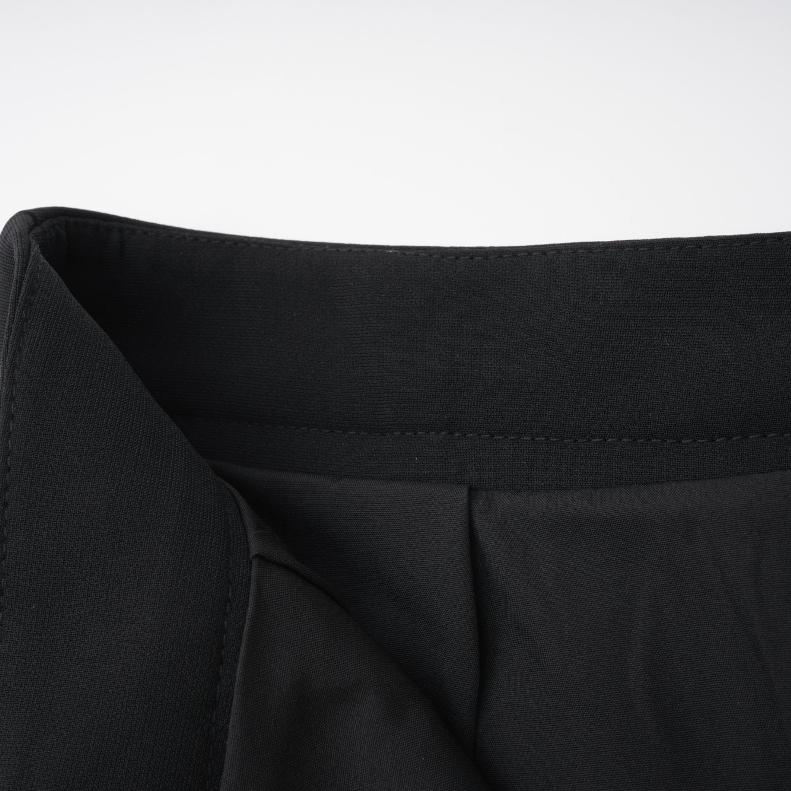 Black structured two-piece midi set with a boxy crop top and an exaggerated hip midi skirt