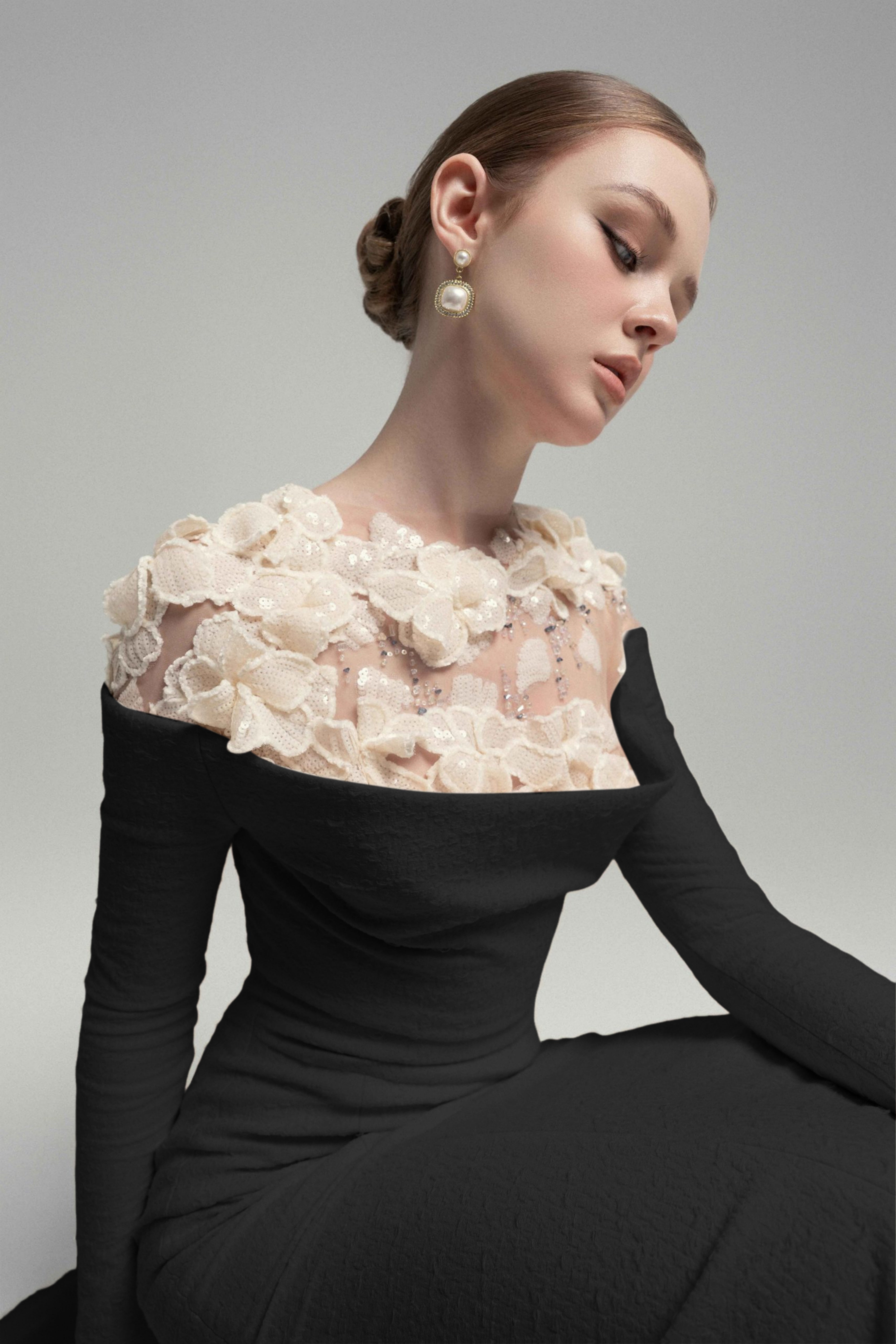 Black mermaid gown with floral appliqué illusion neckline