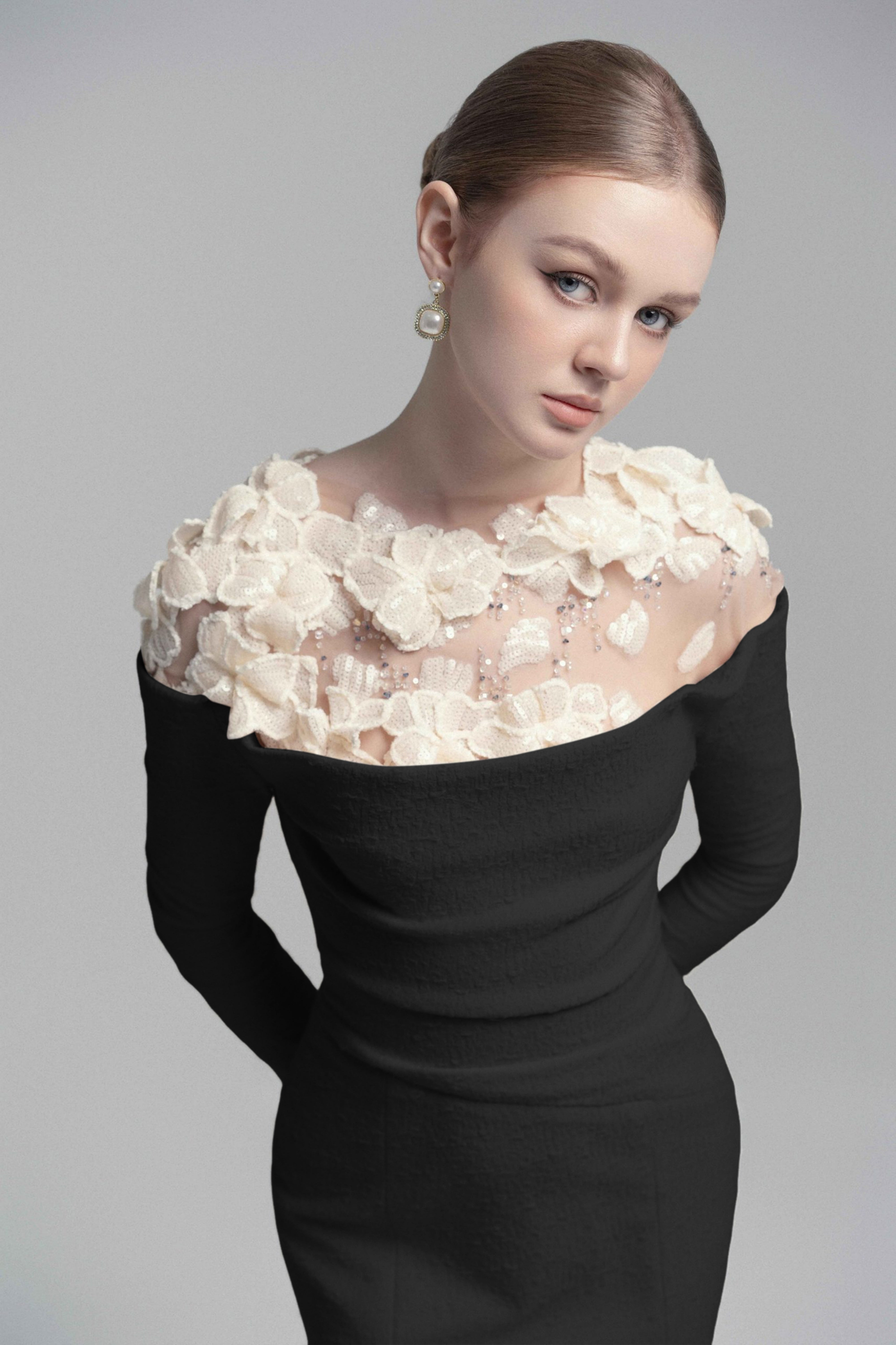 Black mermaid gown with floral appliqué illusion neckline