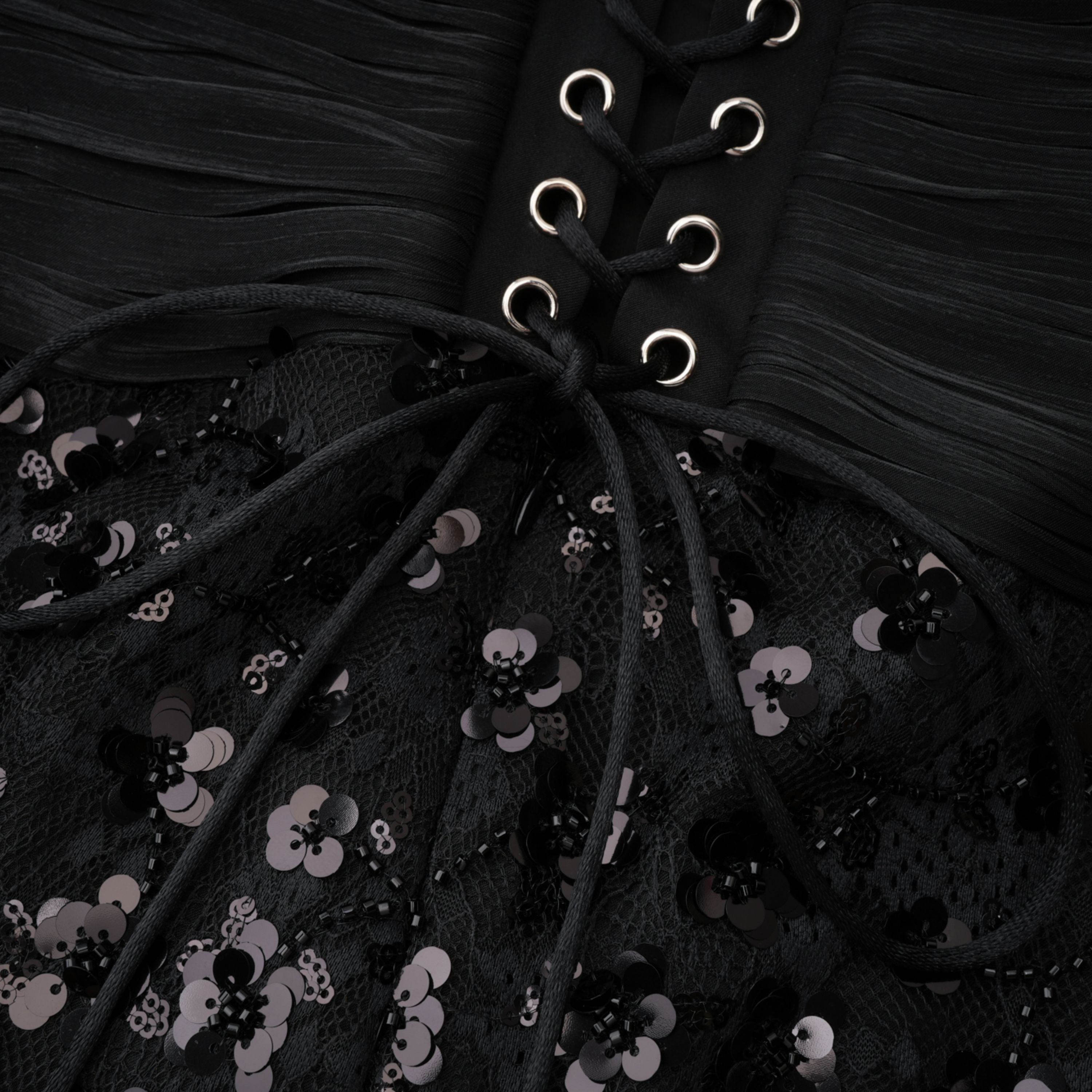 Black halter gown with sequin-embellished lace bodice and hips