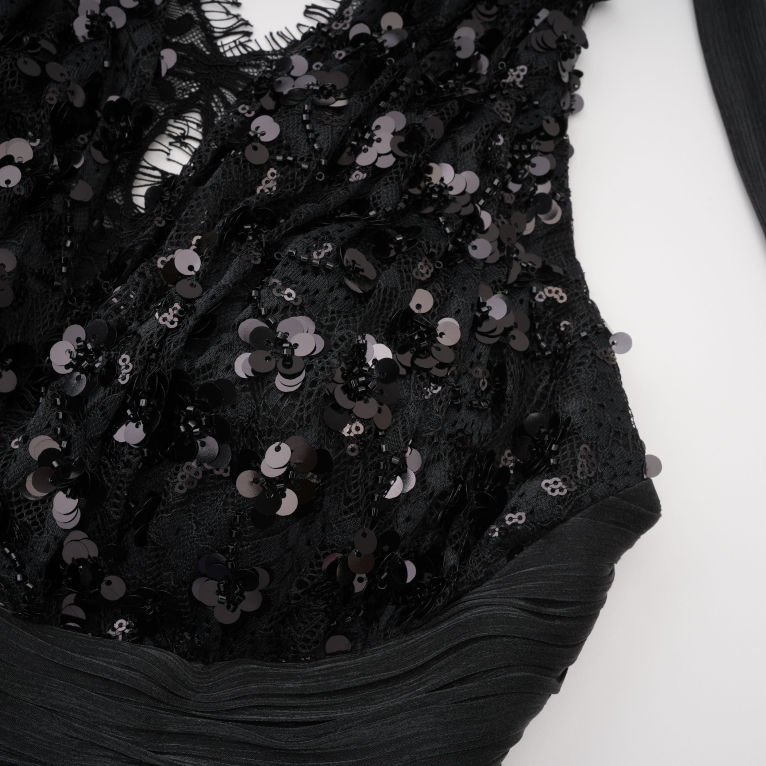 Black halter gown with sequin-embellished lace bodice and hips