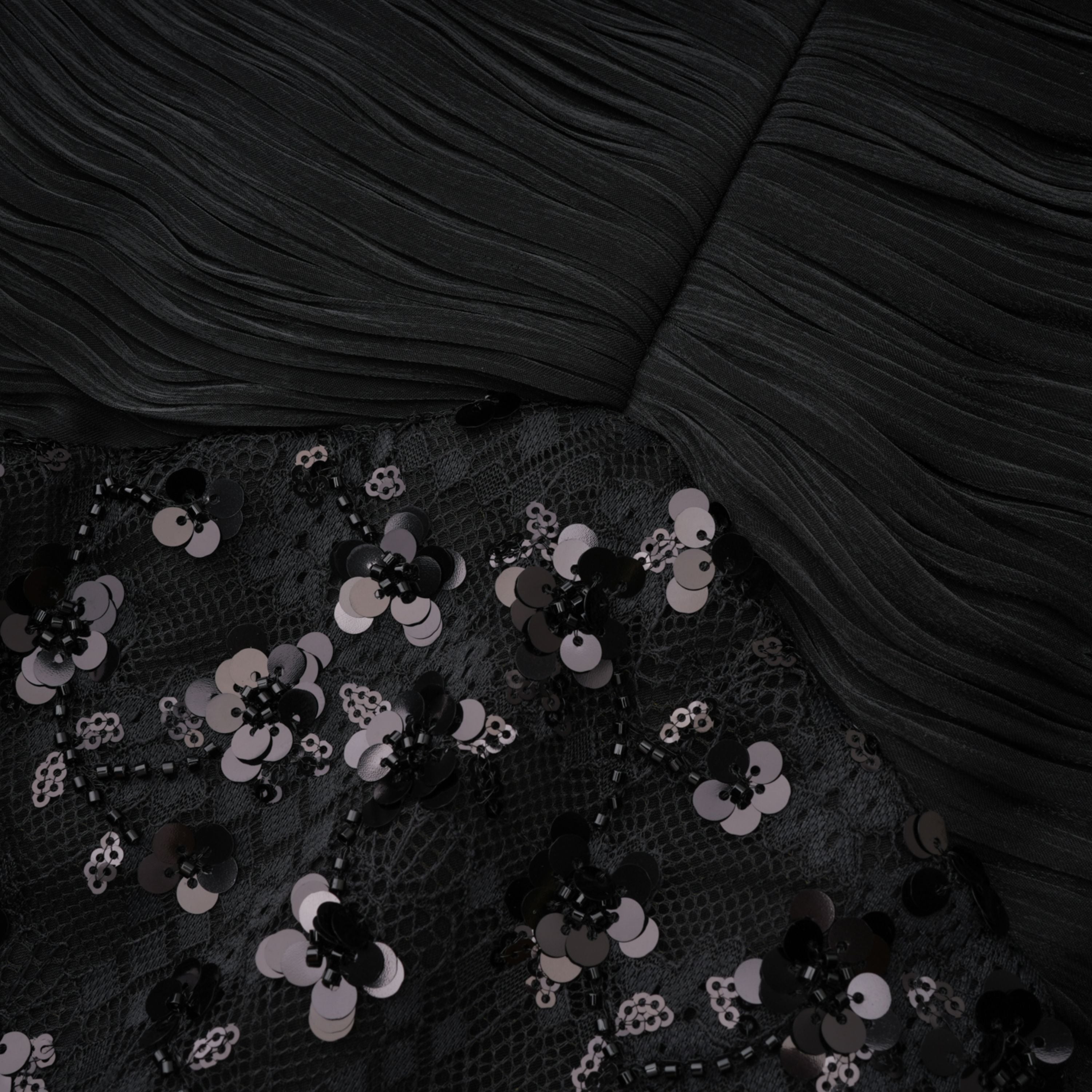Black halter gown with sequin-embellished lace bodice and hips
