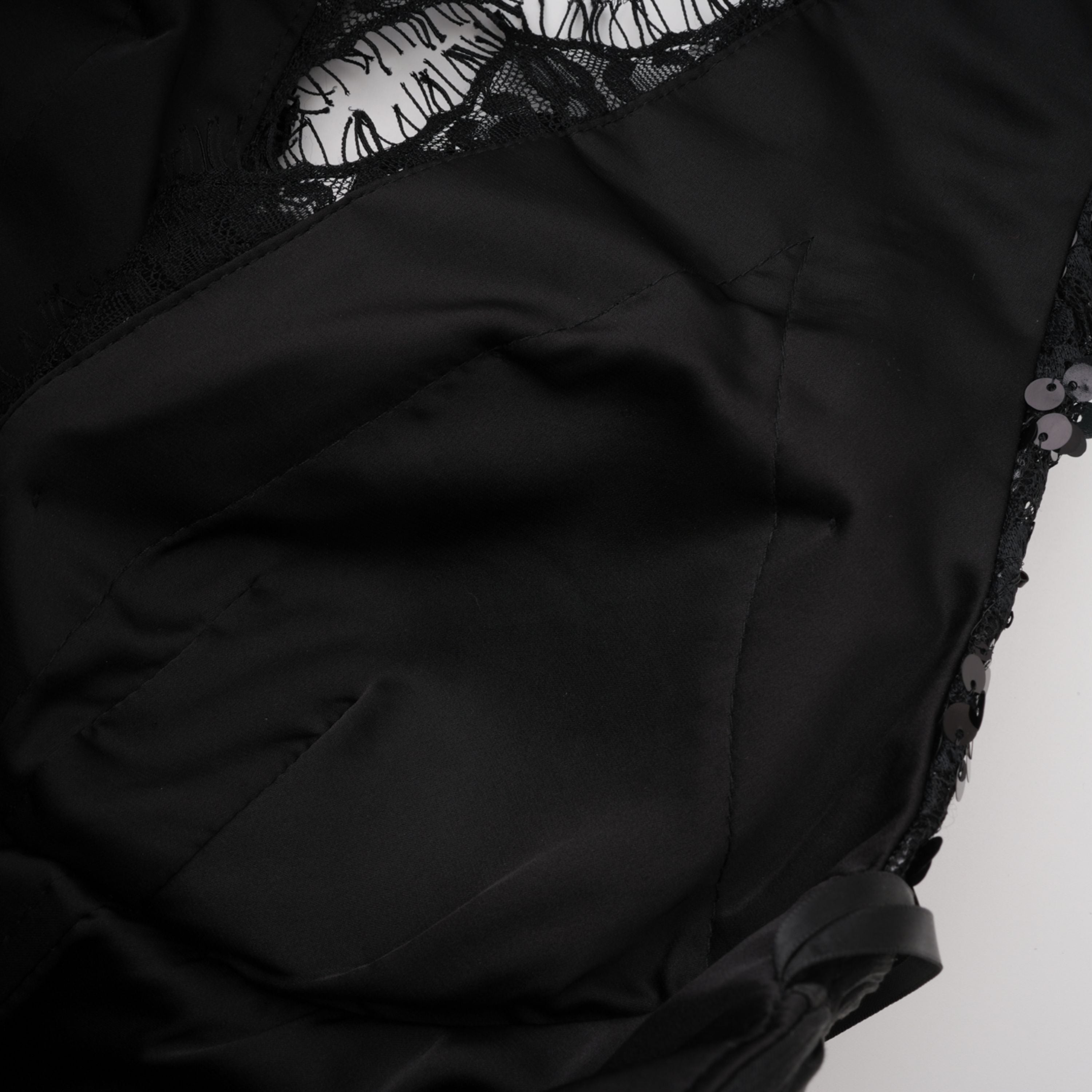 Black halter gown with sequin-embellished lace bodice and hips