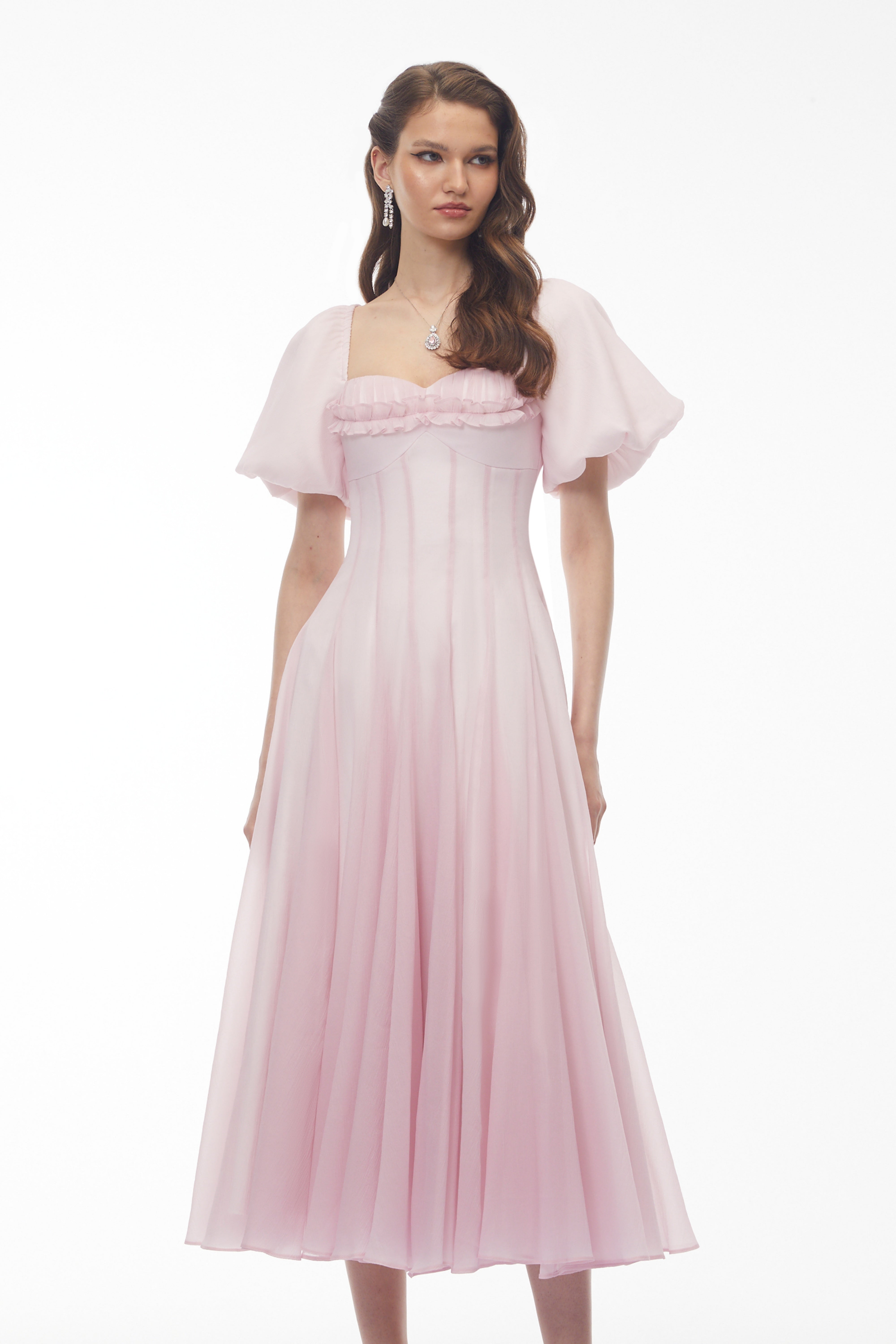 Light pink midi dress with puff sleeves, a ruffled sweetheart neckline, and a pleated skirt