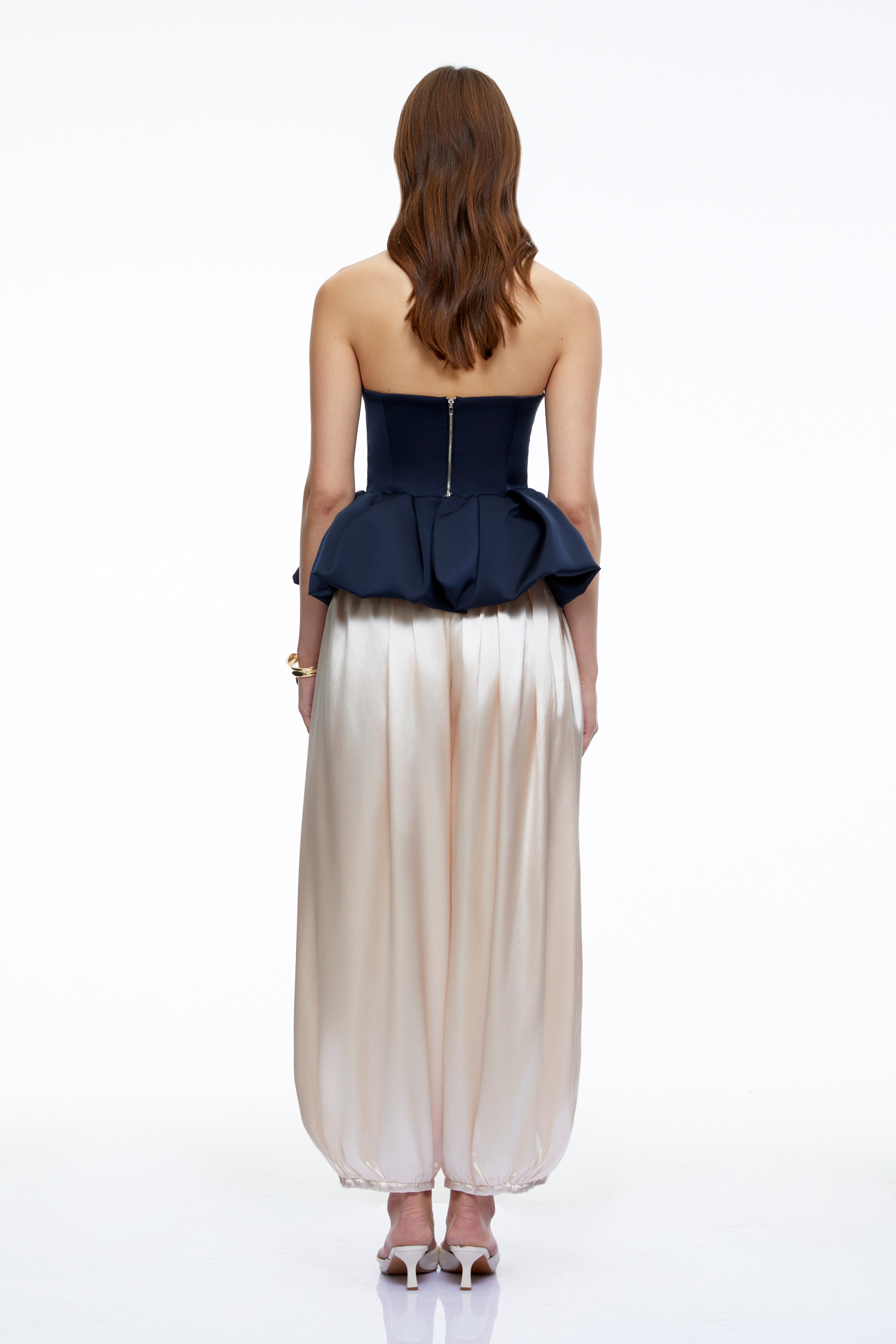 Navy strapless peplum bustier top and beige balloon trousers set