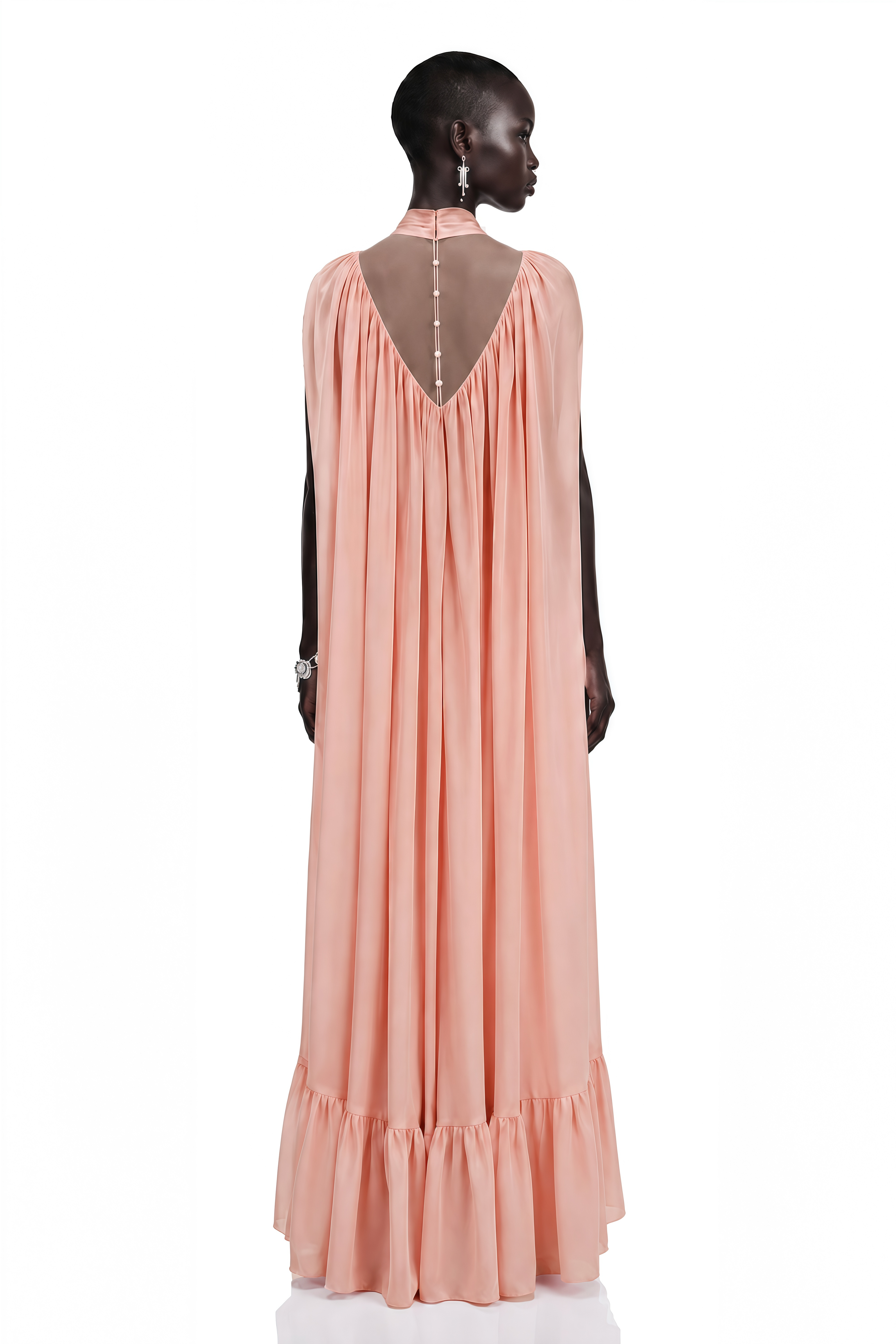 Peach pleated cape maxi gown with high neck scarf and ruffled hem