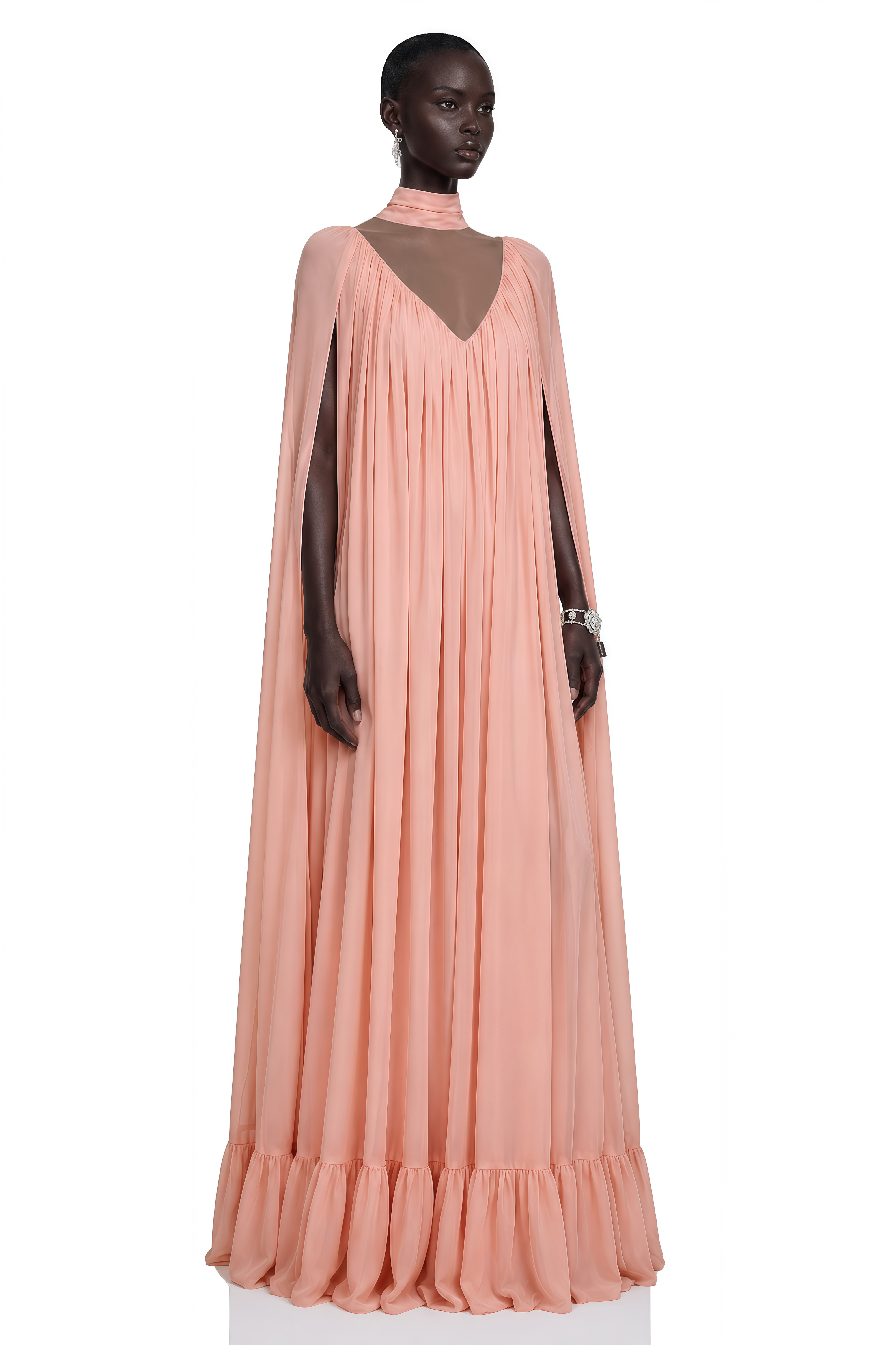 Peach pleated cape maxi gown with high neck scarf and ruffled hem