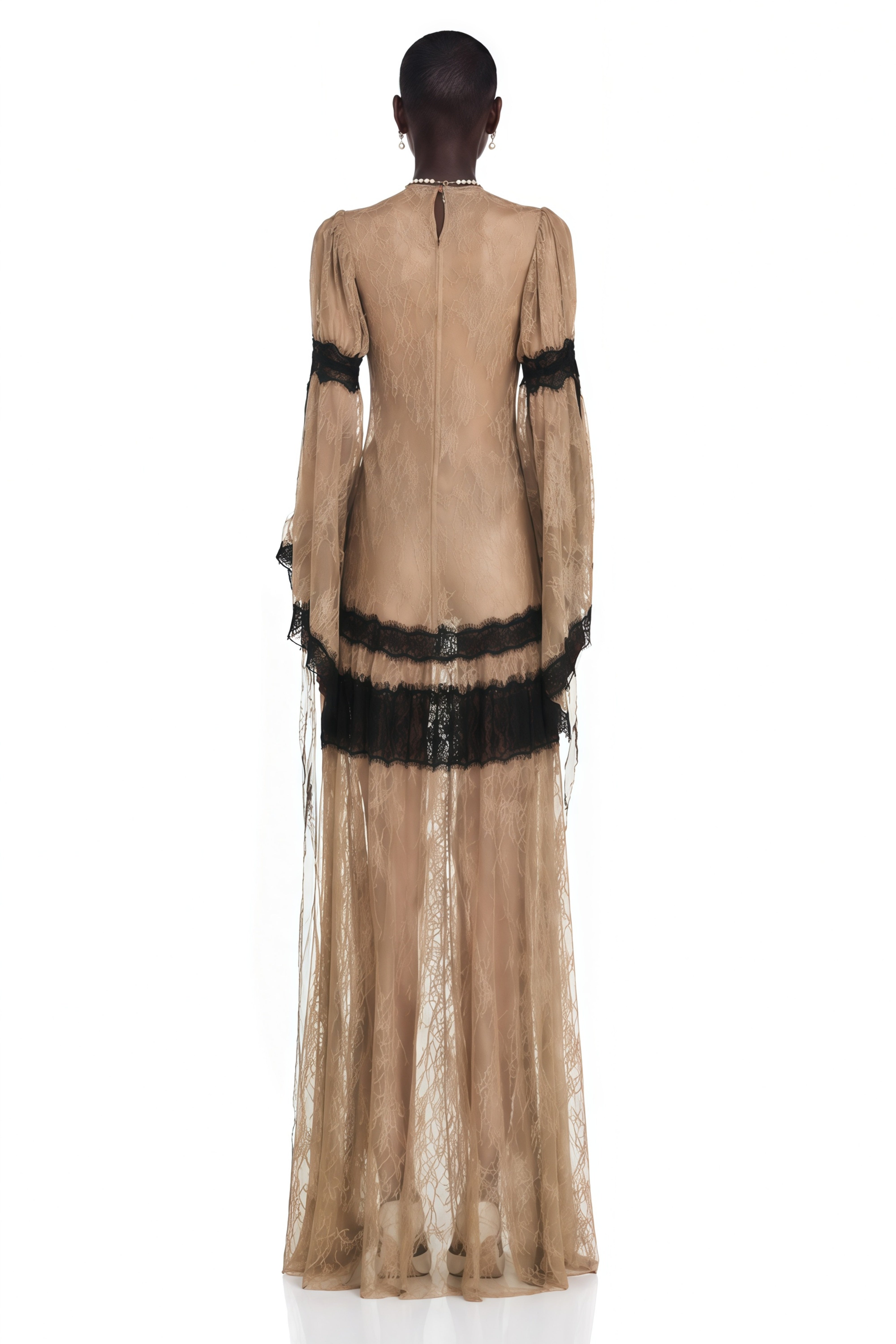 Beige lace maxi dress featuring long bell sleeves and contrast black lace trim
