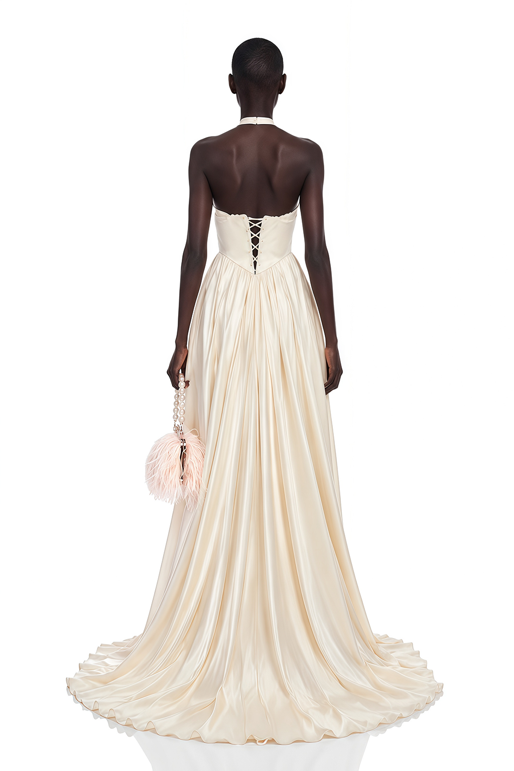Cream halter maxi dress featuring an intricate lace bodice and a flowing pleated skirt