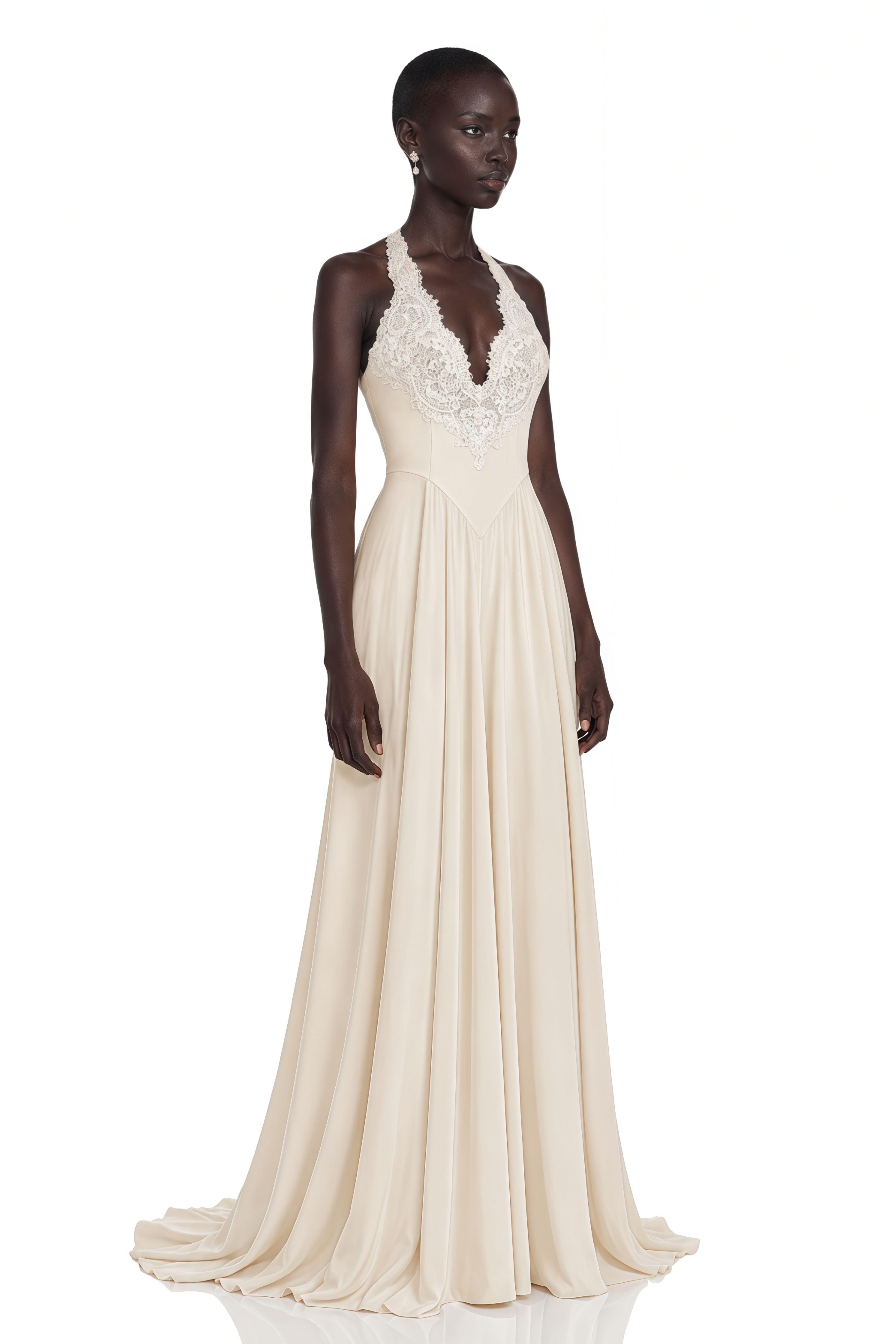 Cream halter maxi dress featuring an intricate lace bodice and a flowing pleated skirt