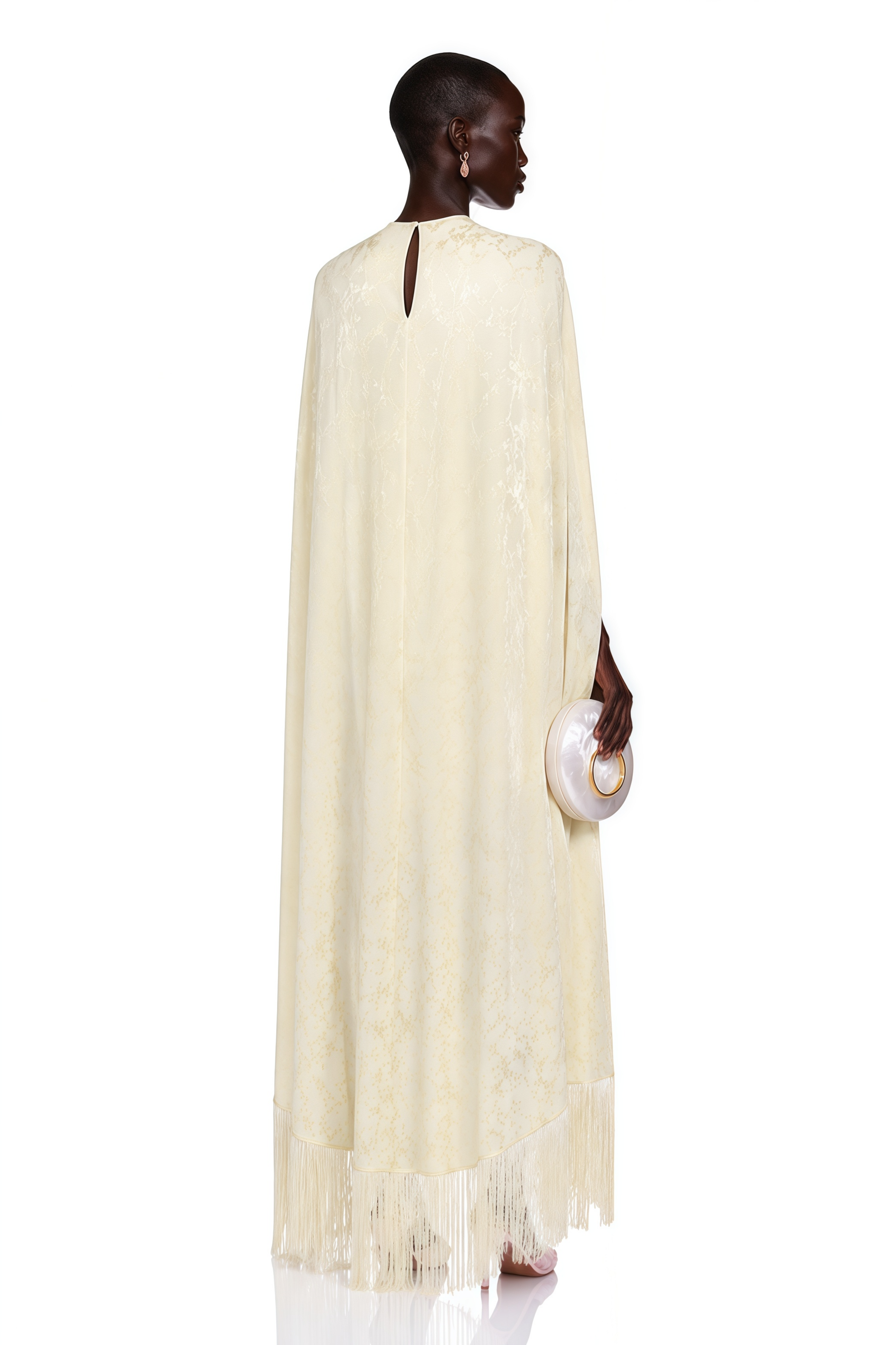Yellow cape gown with fringe trim