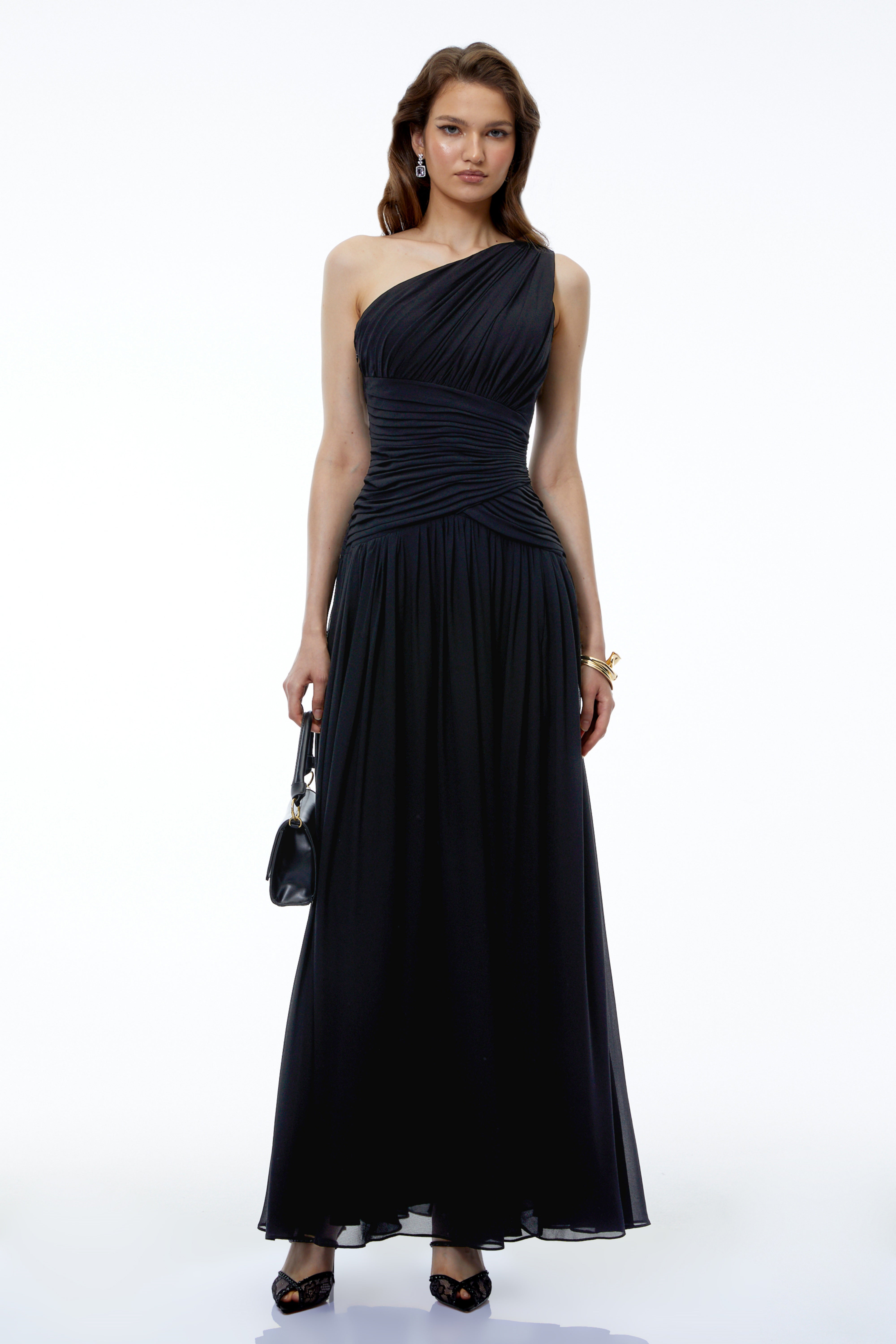 Black one-shoulder maxi dress with a ruched bodice and a high leg slit