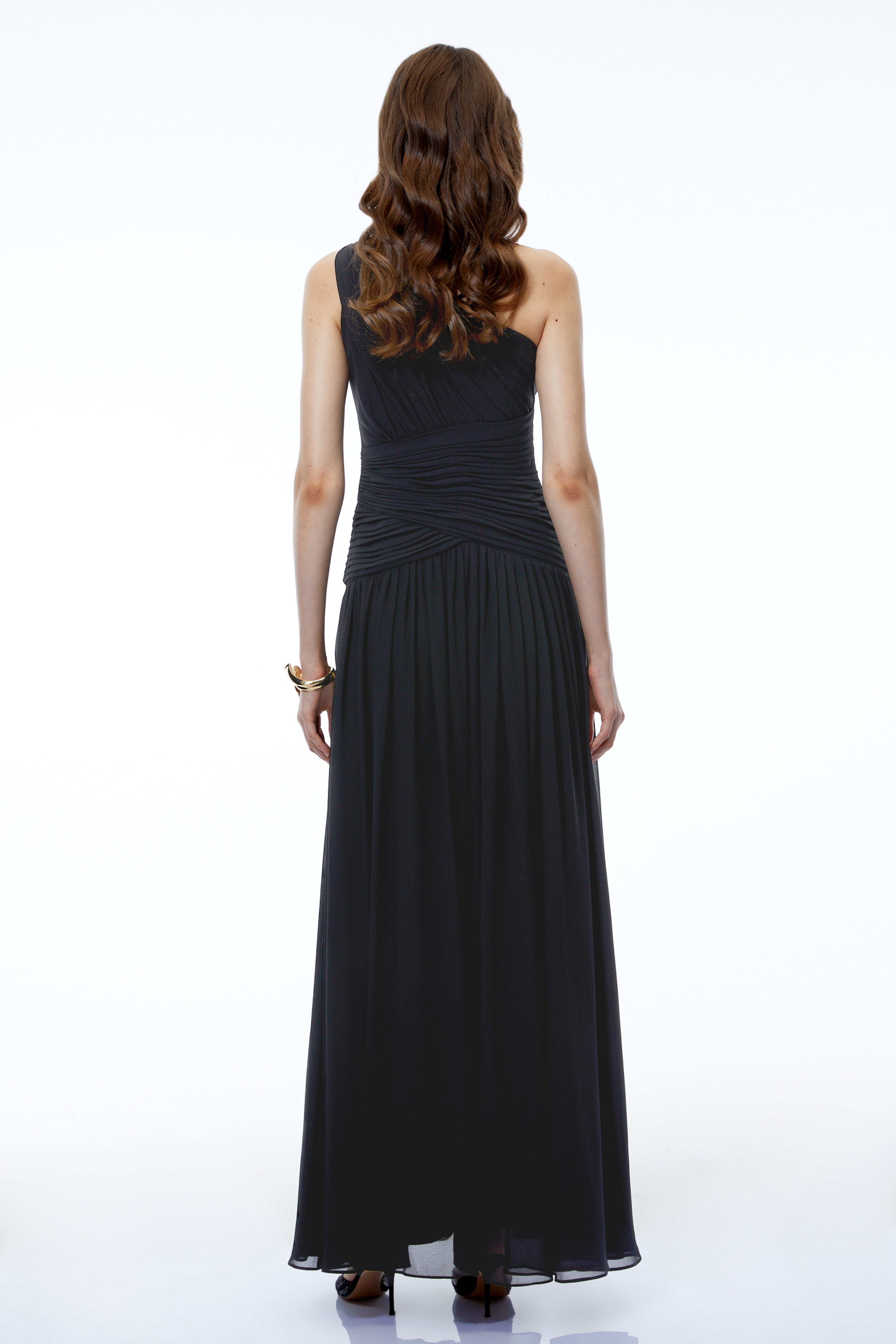 Black one-shoulder maxi dress with a ruched bodice and a high leg slit