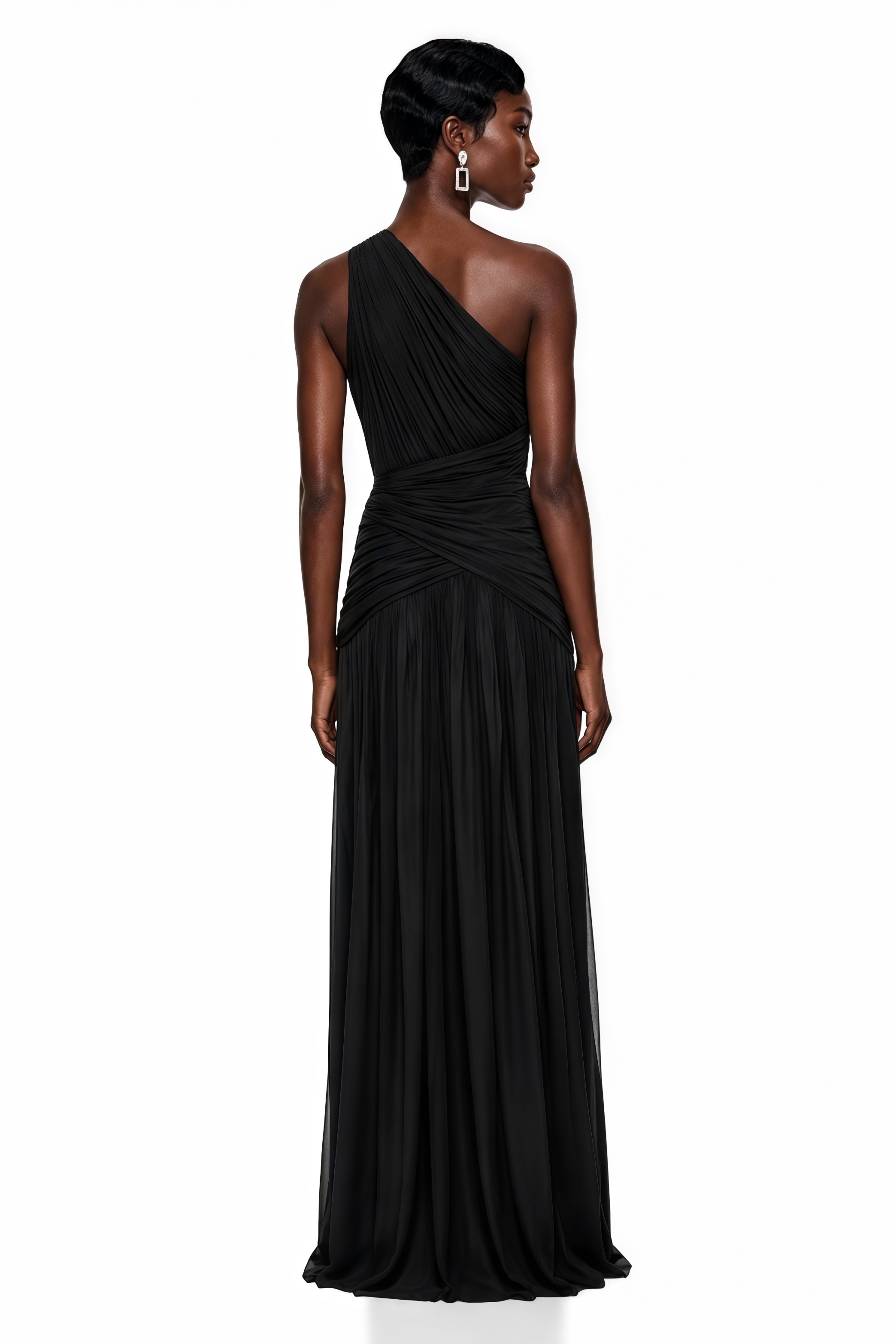 Black pleated one-shoulder maxi dress featuring a crisscross ruched bodice and a high thigh slit
