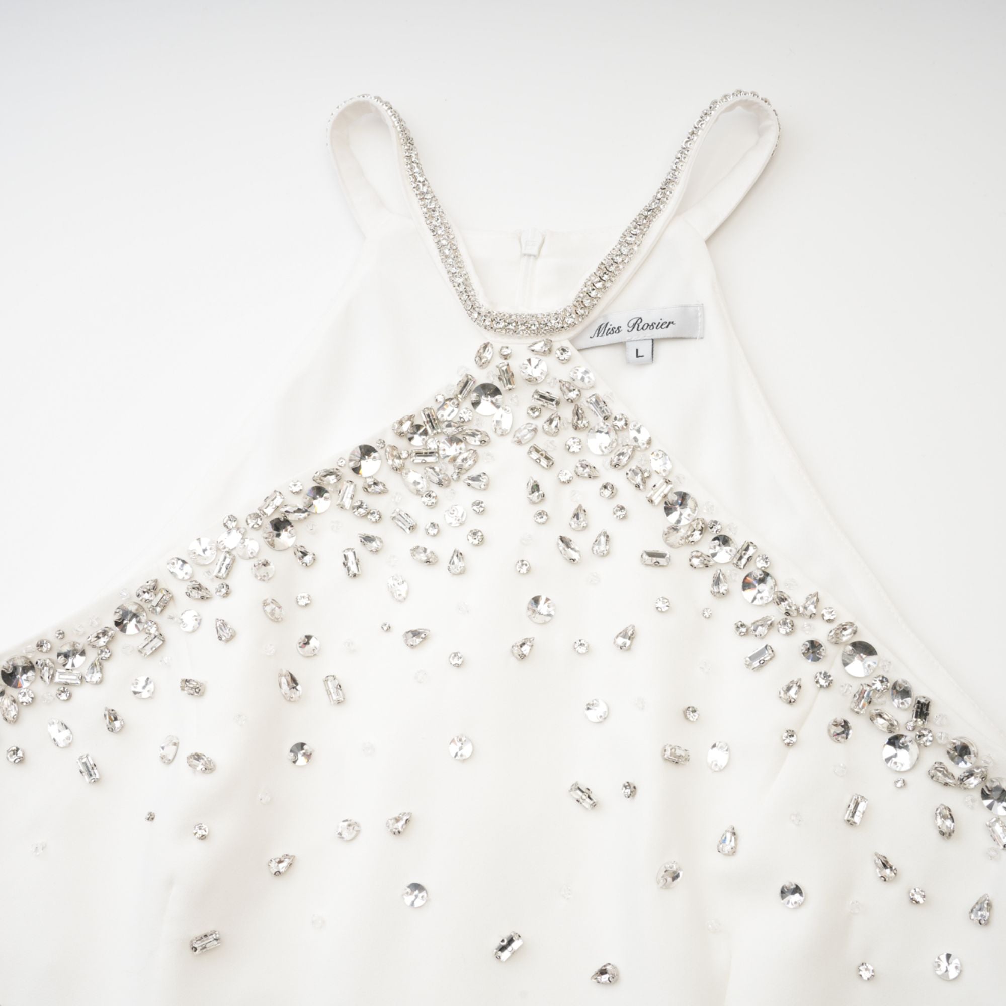 Black halter mini dress embellished with crystals on the neckline and bodice