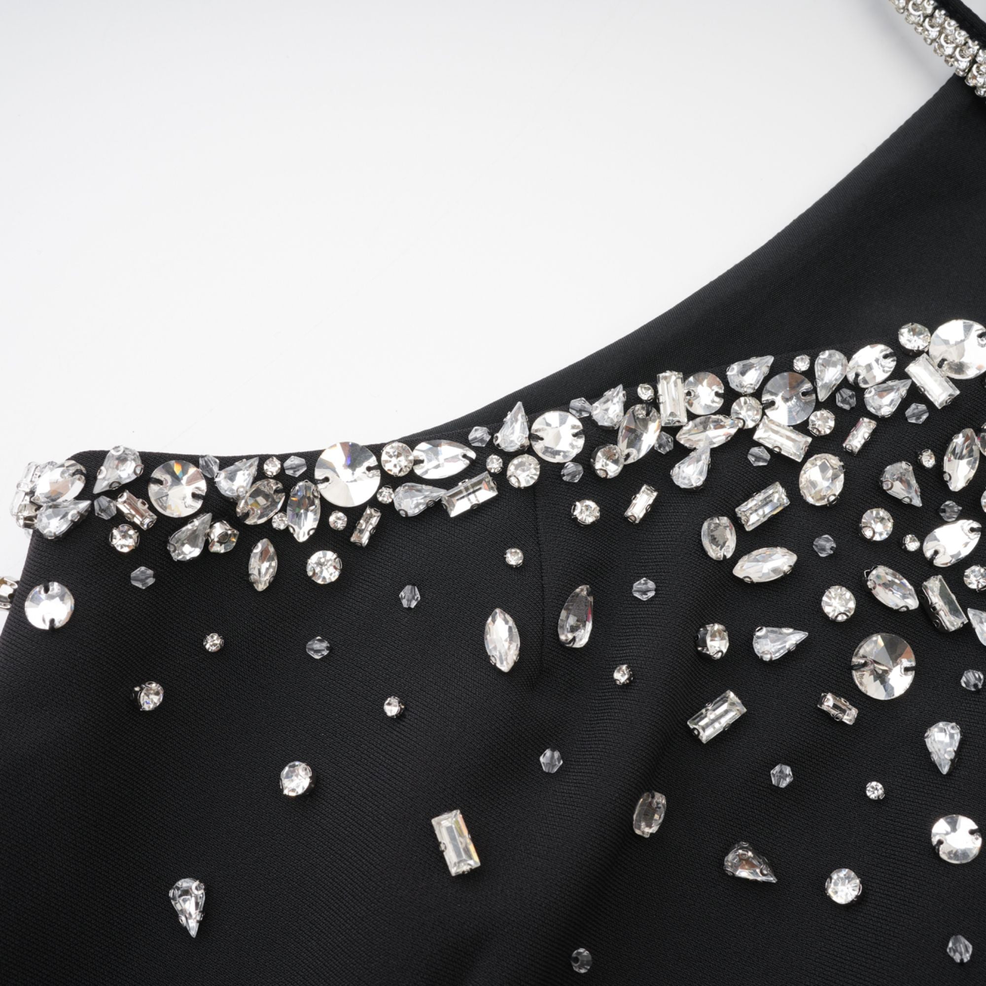 Black halter mini dress embellished with crystals on the neckline and bodice