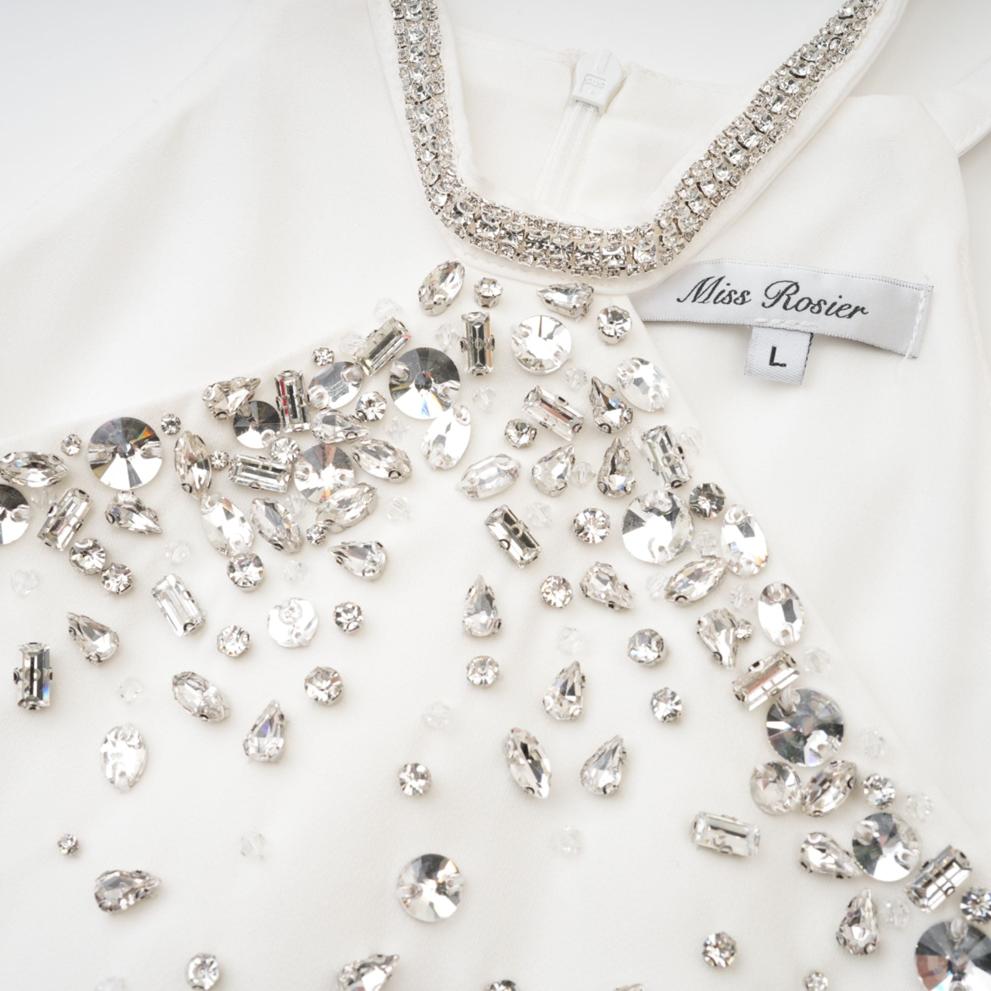 Black halter mini dress embellished with crystals on the neckline and bodice