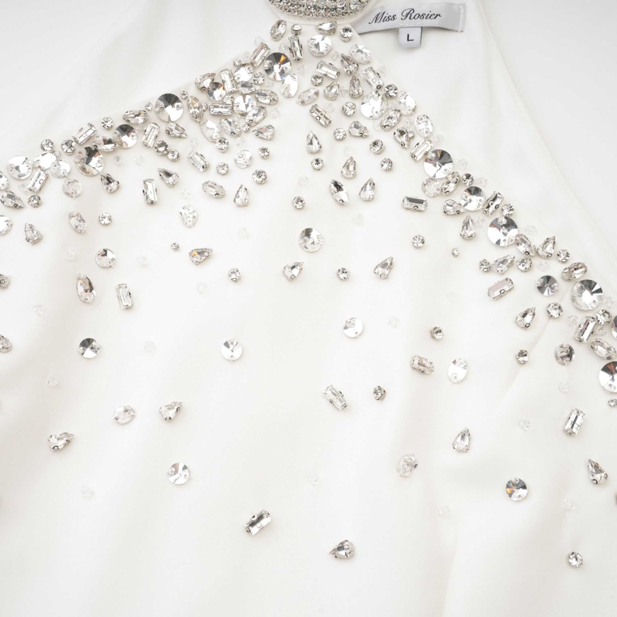 Black halter mini dress embellished with crystals on the neckline and bodice