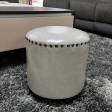 Contemporary Round Faux Leather Ottoman with Nailhead Trim and Solid Wood Frame