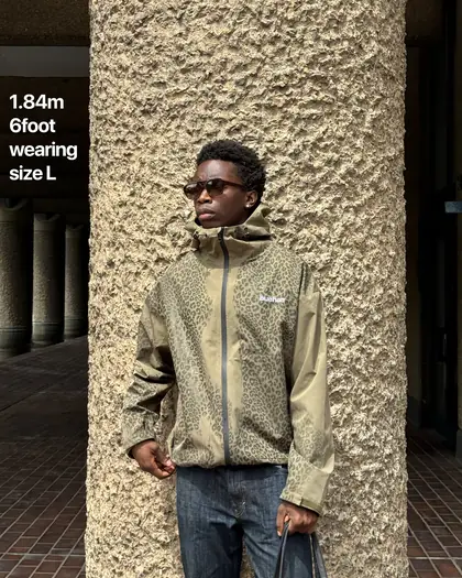 Model wearing the brown reactive jacket in the countryside