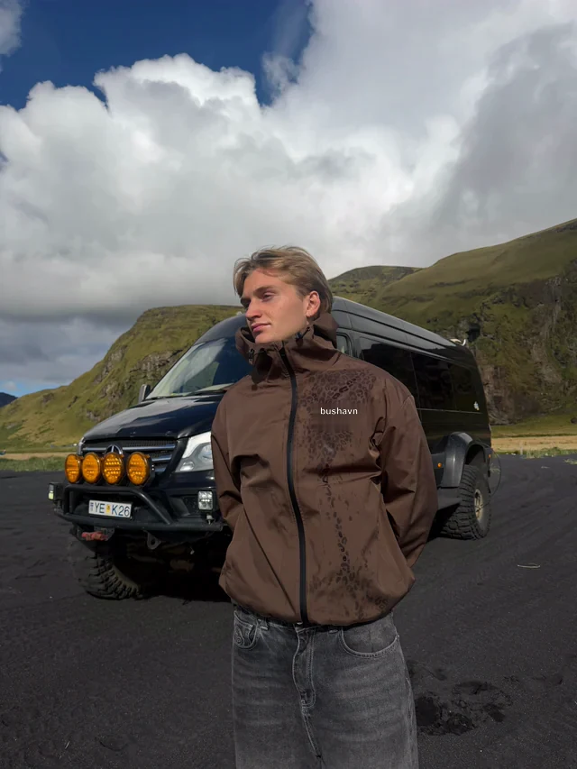 Brown jacket in open landscape
