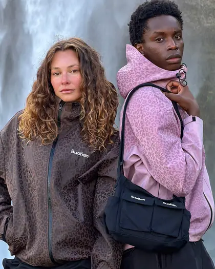 Two models wearing burgundy reactive jackets