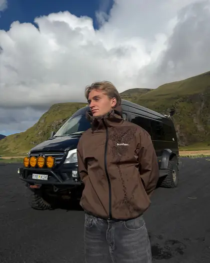 Model wearing the brown reactive jacket outdoors