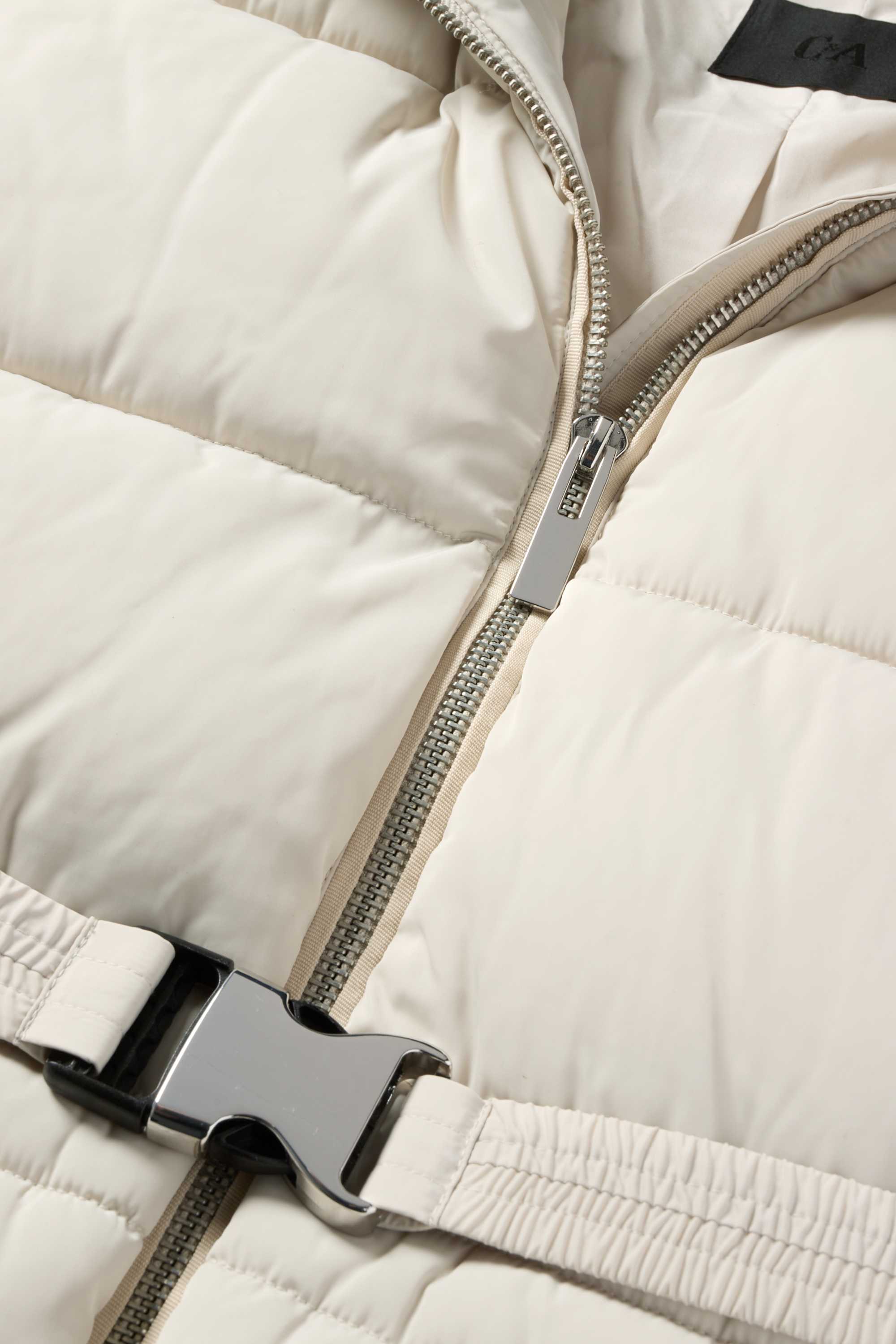 Quilted jacket with belt, hood and faux fur trim light beige