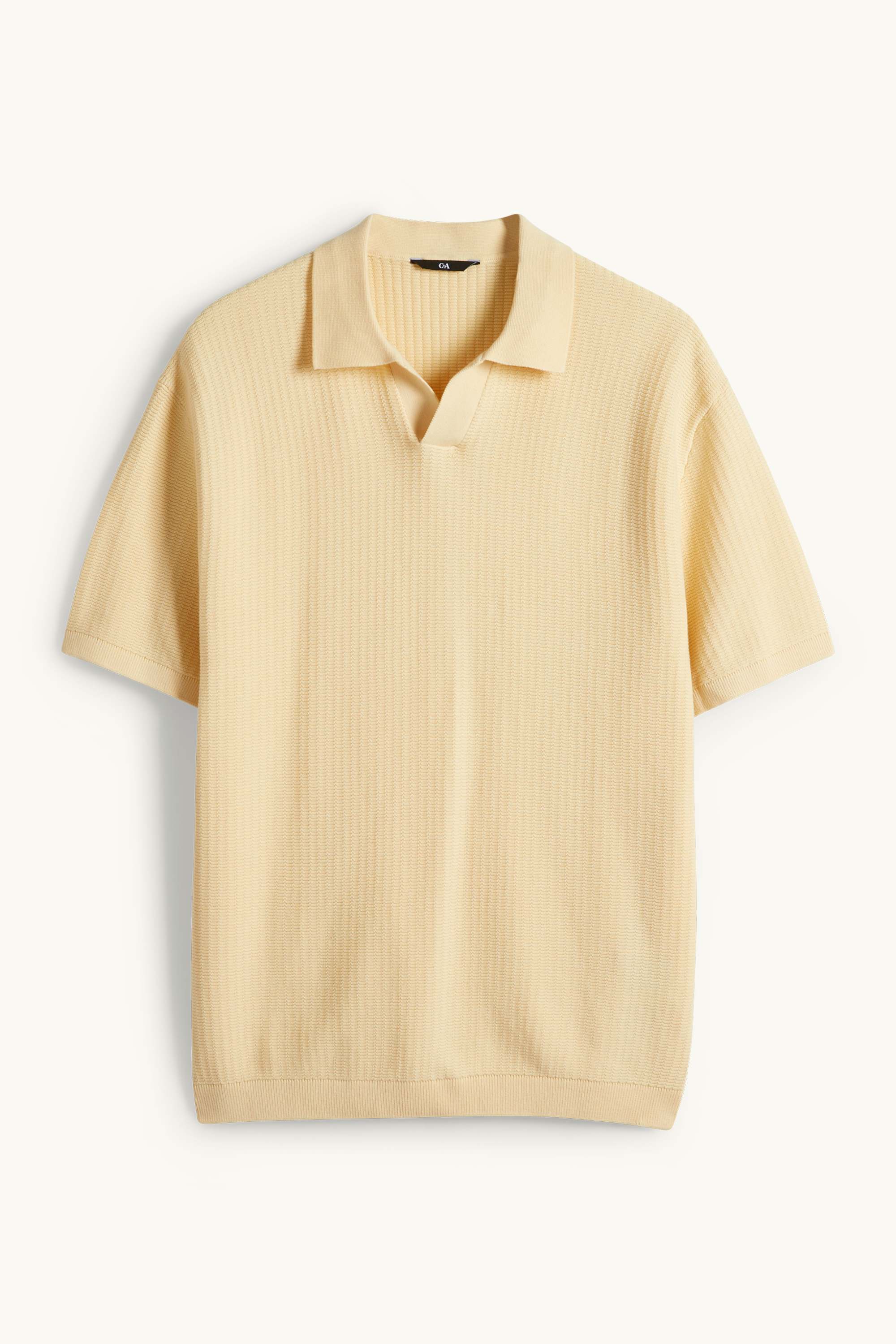 Knitted polo shirt - relaxed fit - textured light yellow