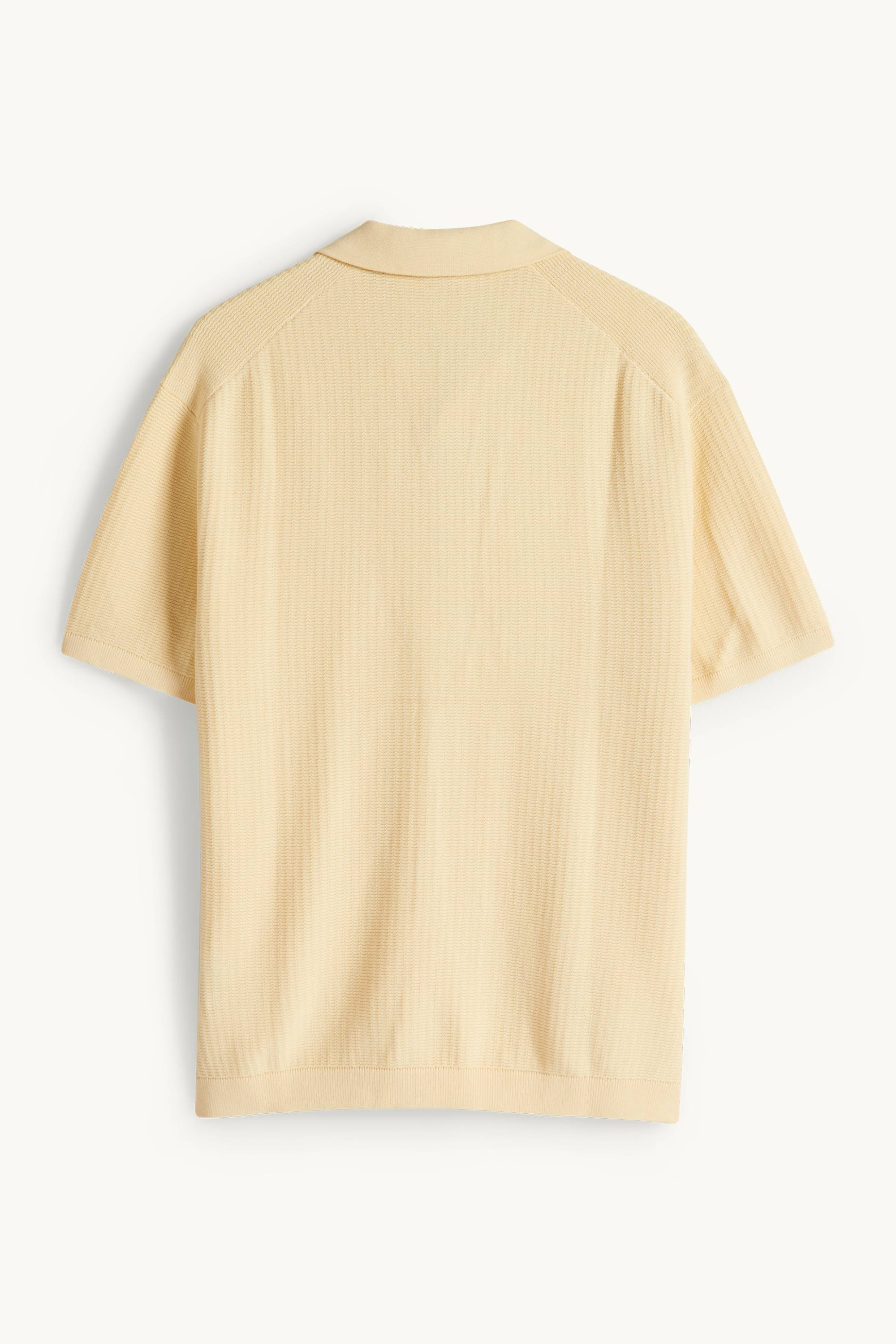 Knitted polo shirt - relaxed fit - textured light yellow