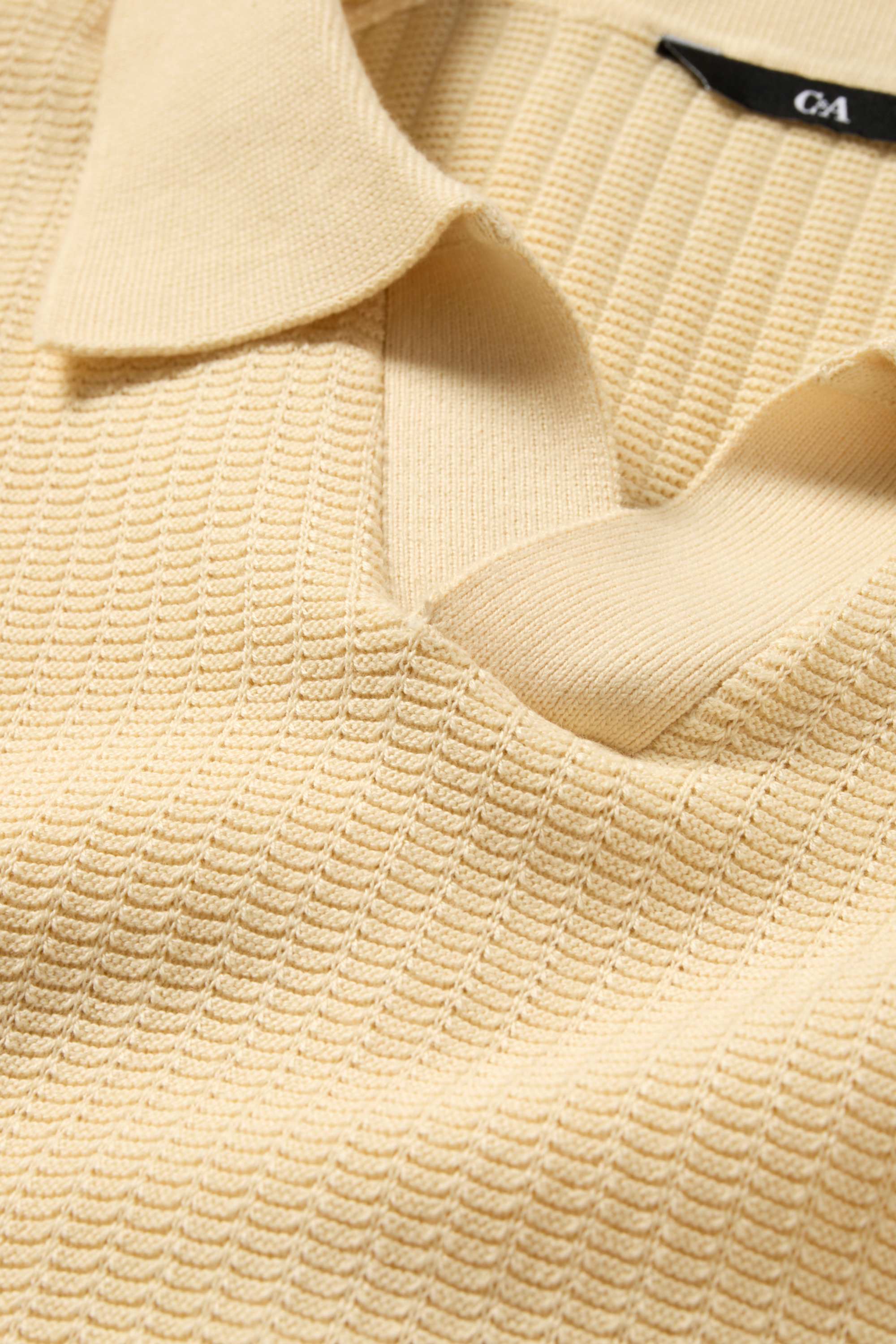 Knitted polo shirt - relaxed fit - textured light yellow