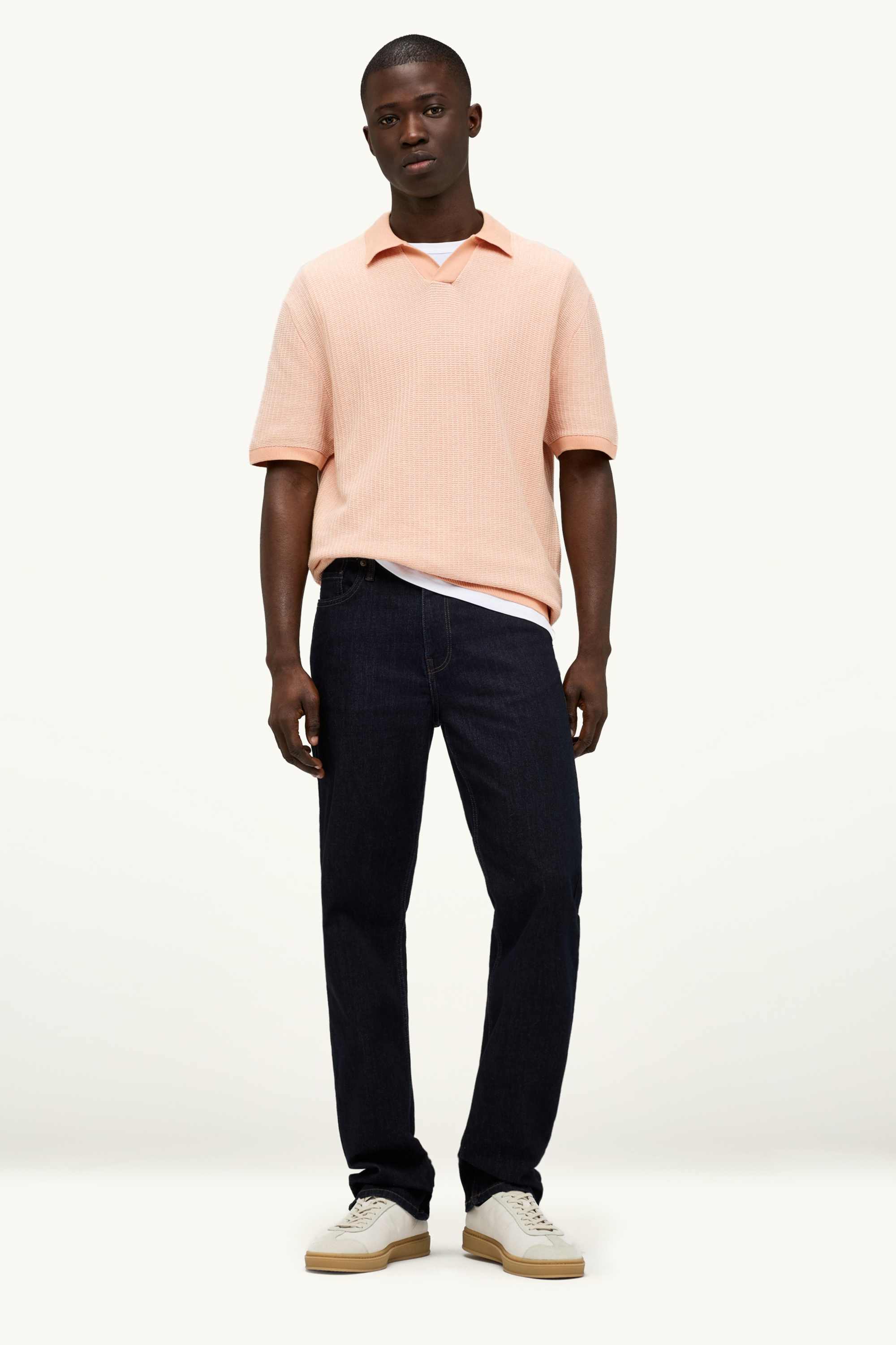 Knitted polo shirt - relaxed fit - textured orange