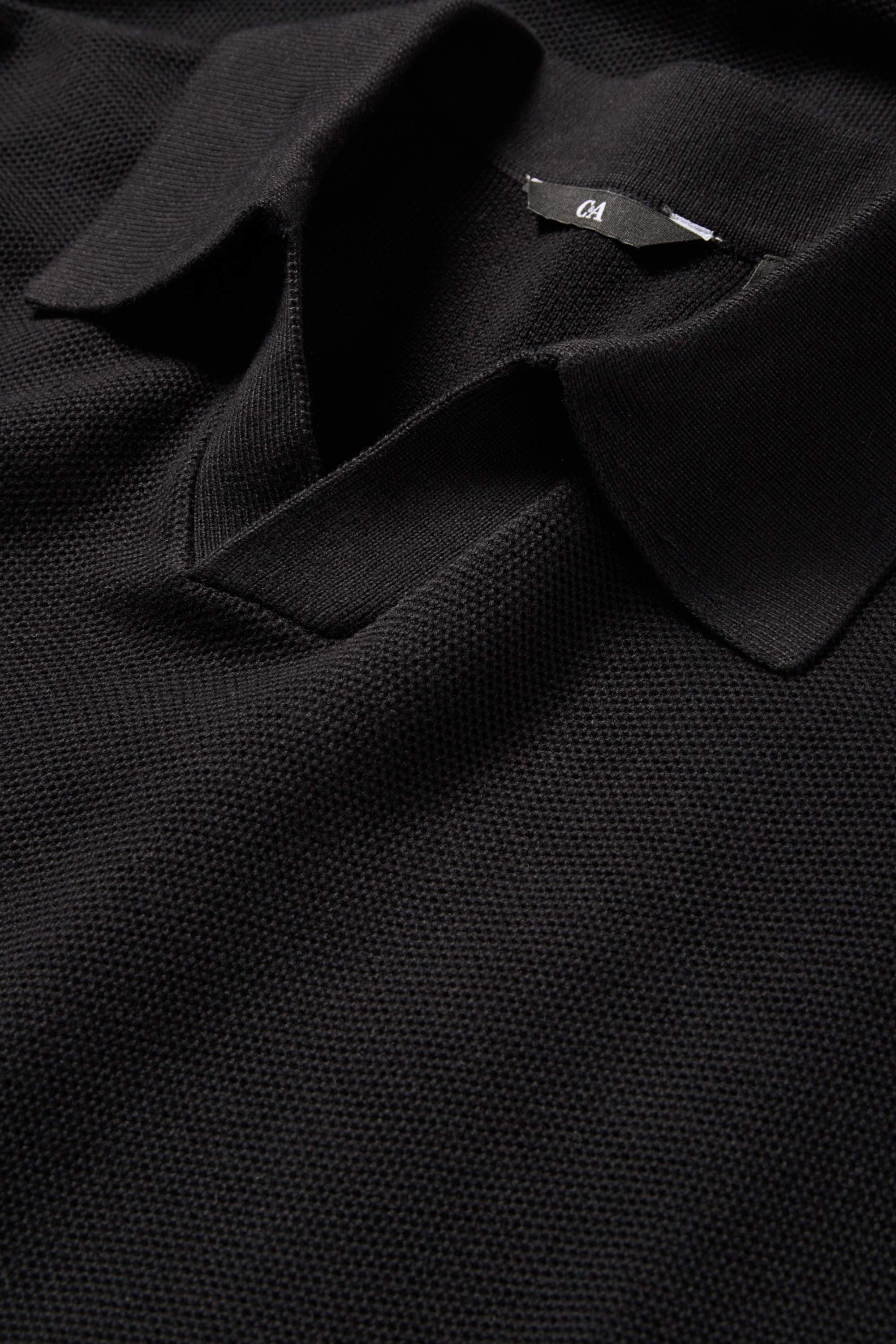 Knitted polo shirt - regular fit - textured black