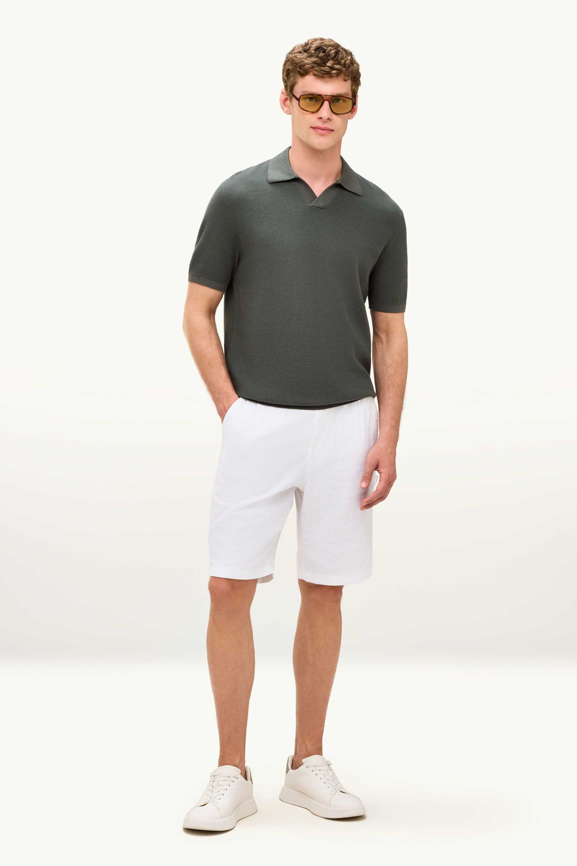 Knitted polo shirt - regular fit - textured dark green