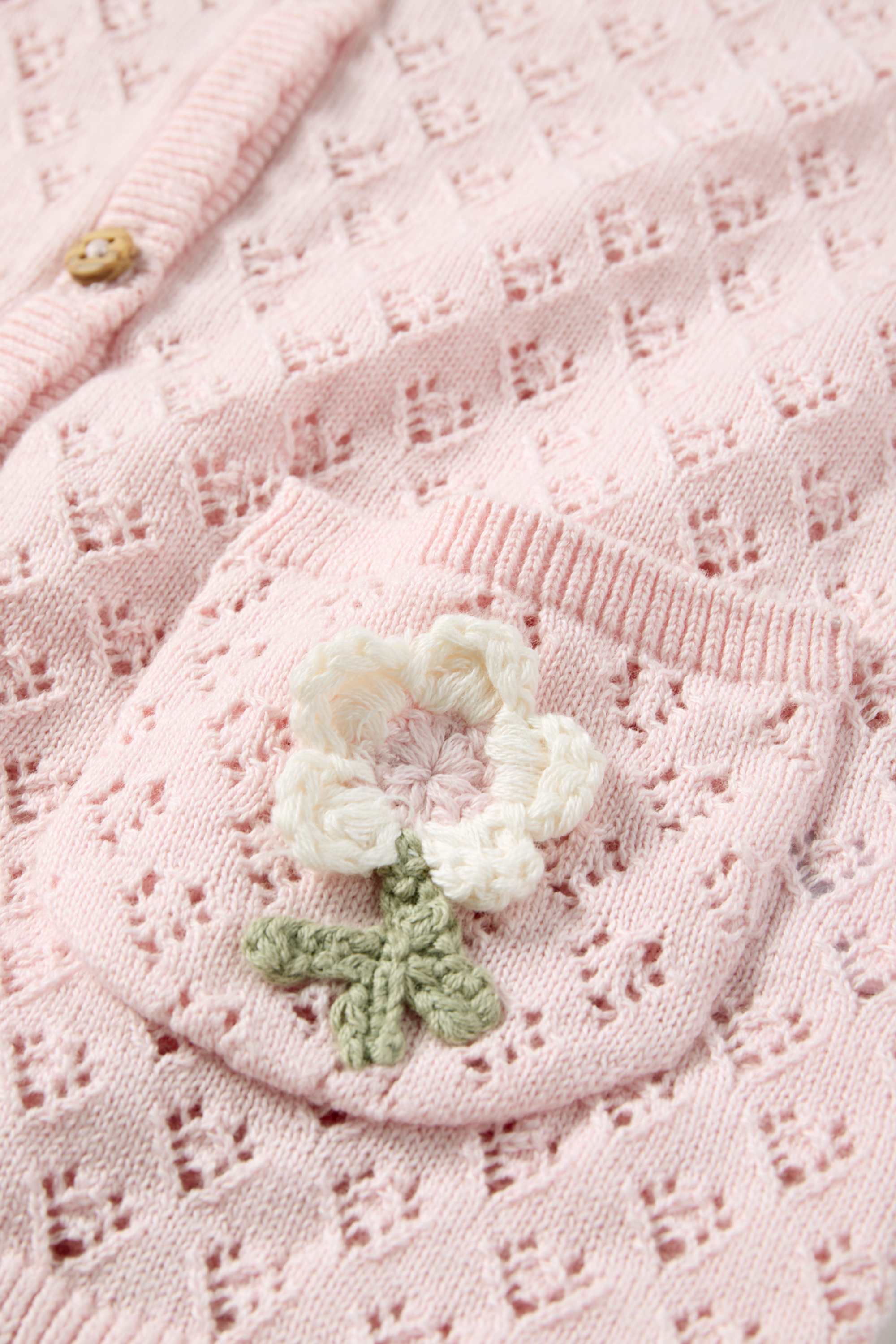 Floral - crocheted baby cardigan rose