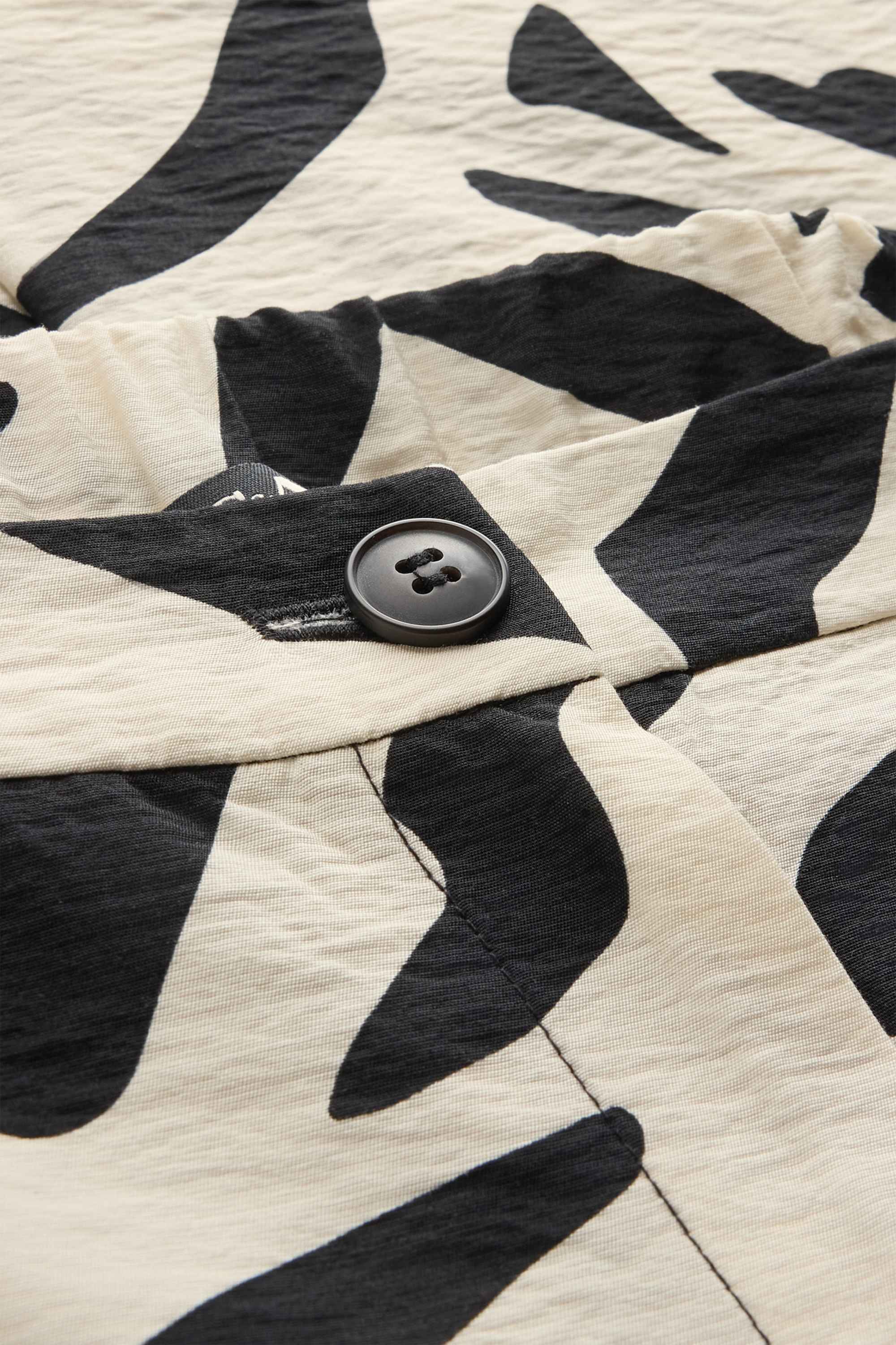 Cloth trousers - high waist - wide leg - patterned white / black