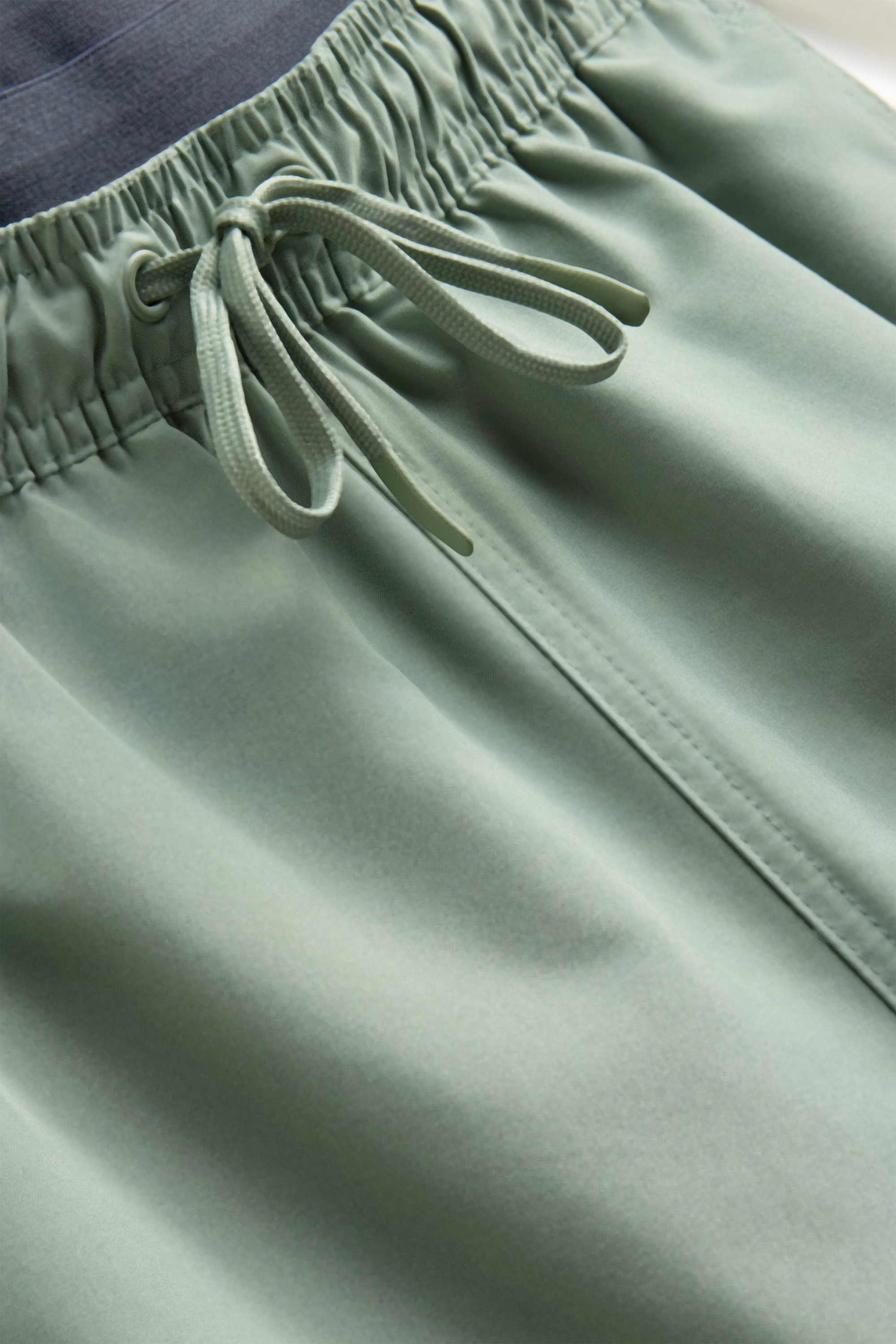 Swim shorts - 2-in-1 look light green