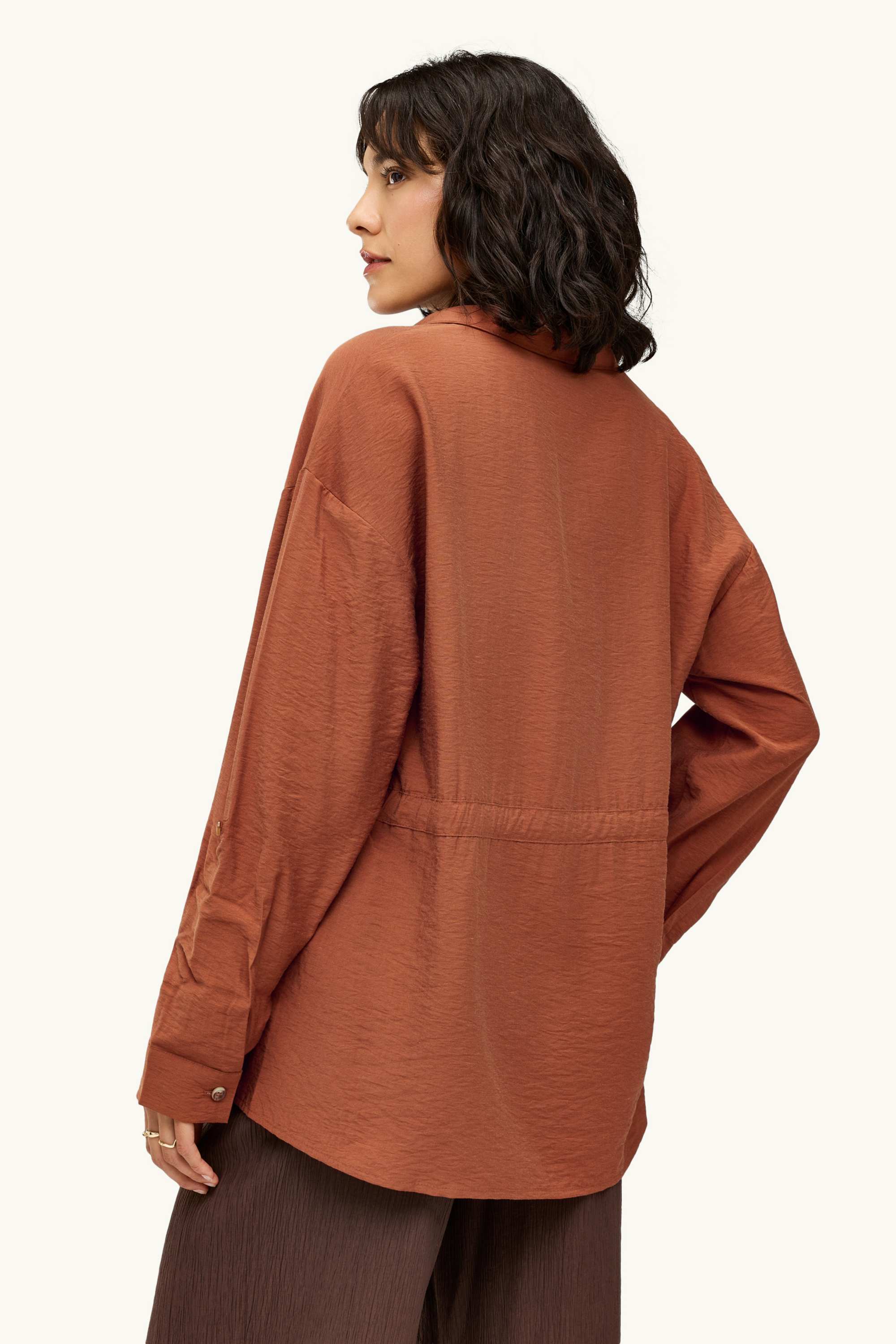 Linen blouse with knot detail and V-neck rust