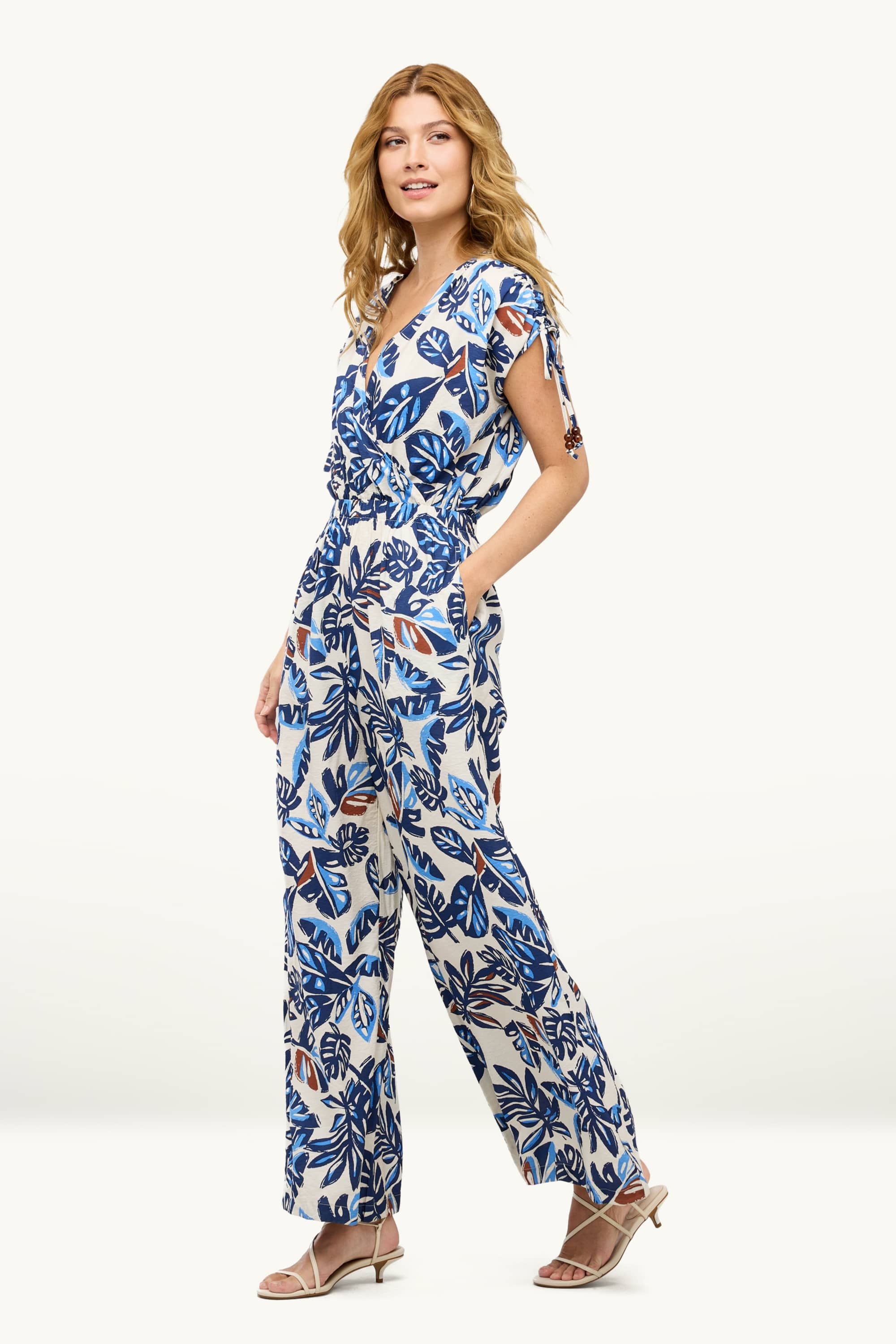 V-neck jumpsuit with beads - patterned blue / white