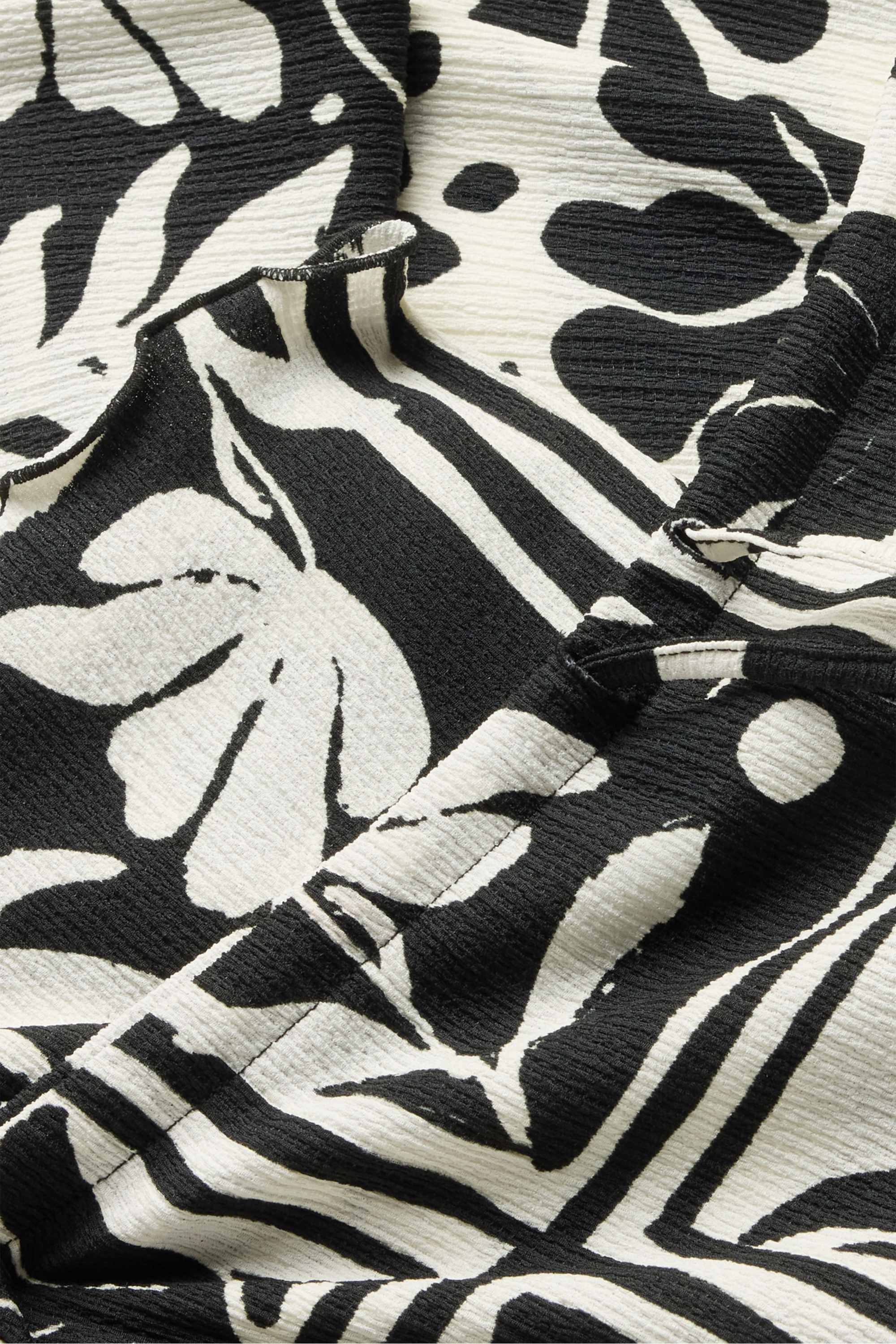 Cloth trousers - high-rise waist - straight fit - floral white / black