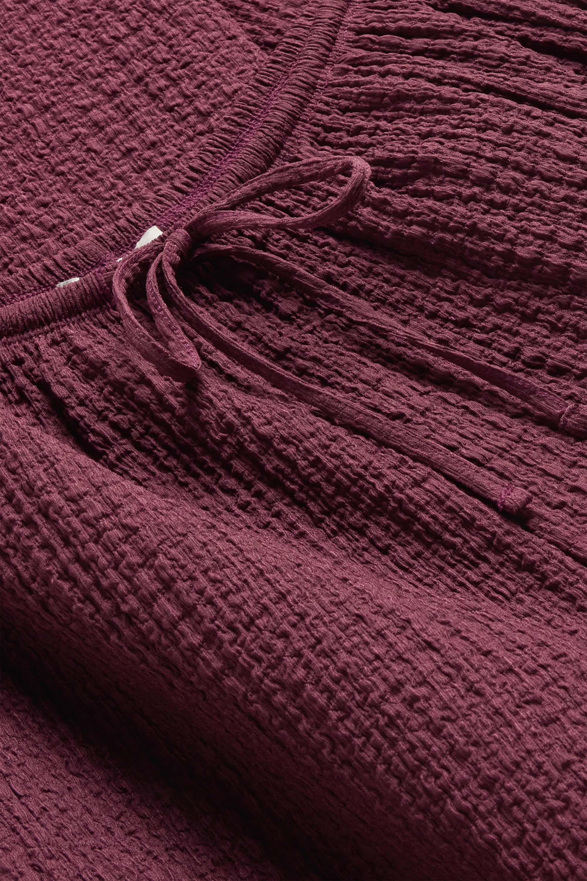 Cloth trousers - mid-rise waist - loose fit - textured dark red