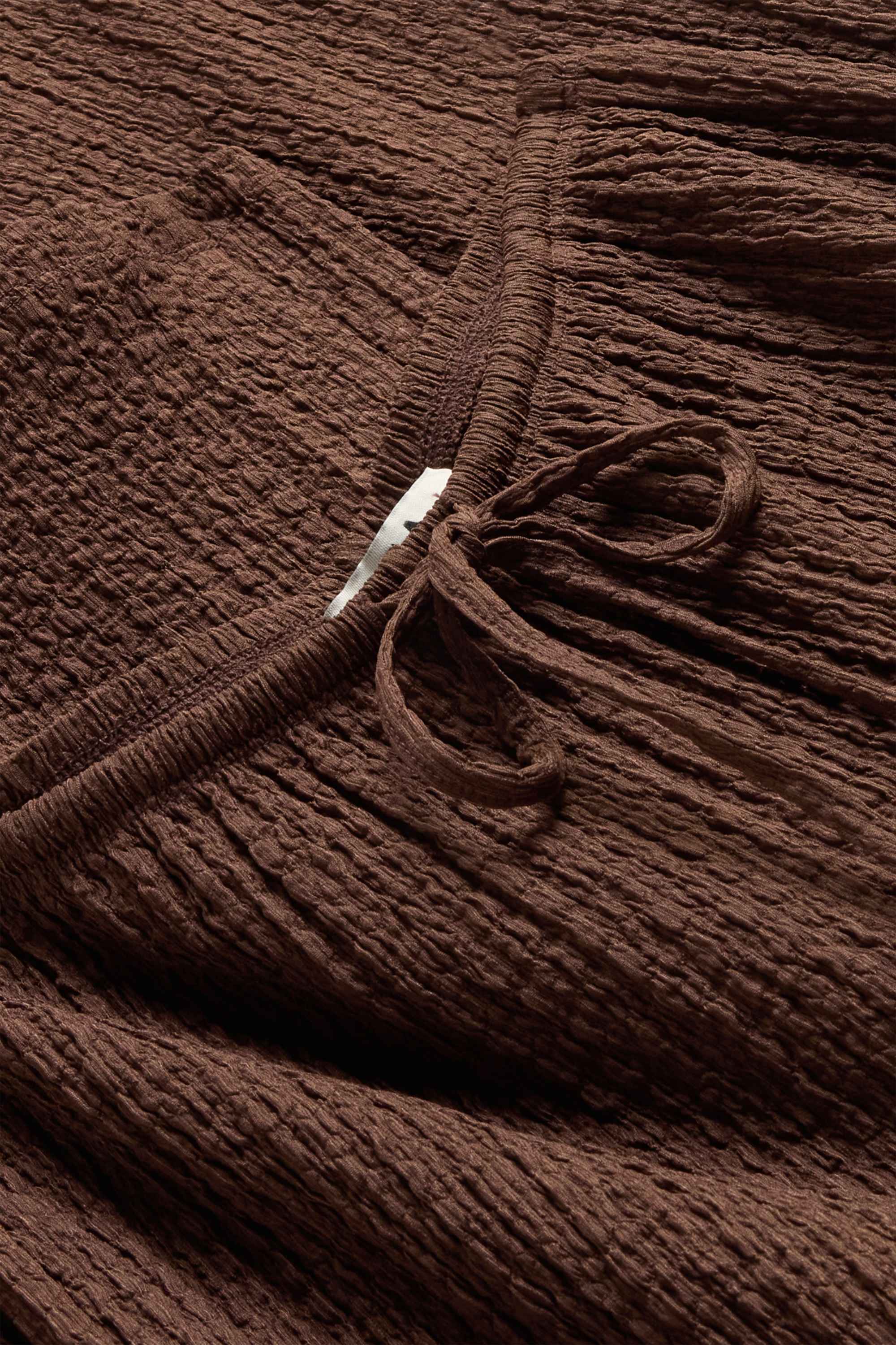 Cloth trousers - mid-rise waist - loose fit - textured dark brown