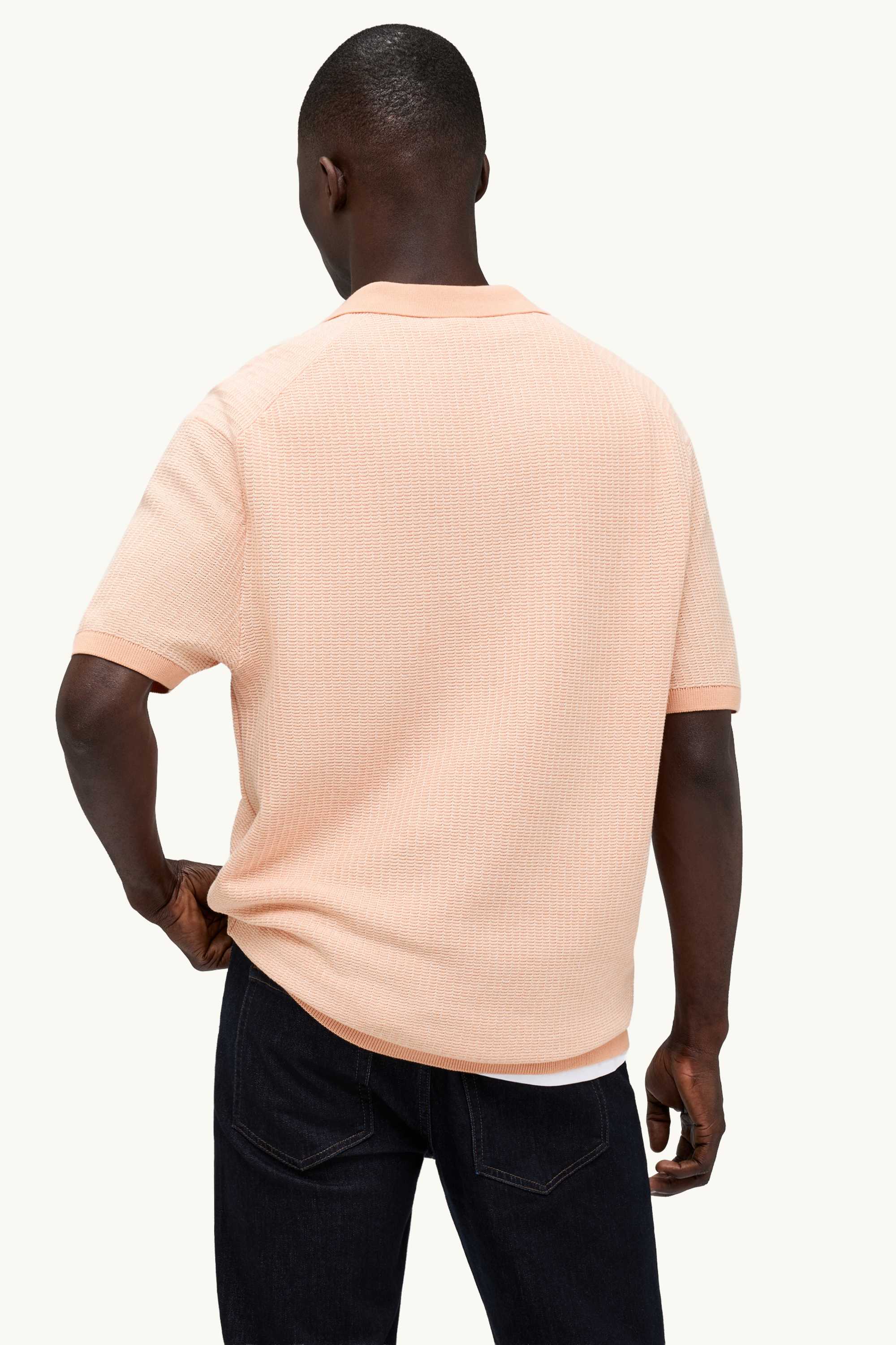 Knitted polo shirt - relaxed fit - textured orange